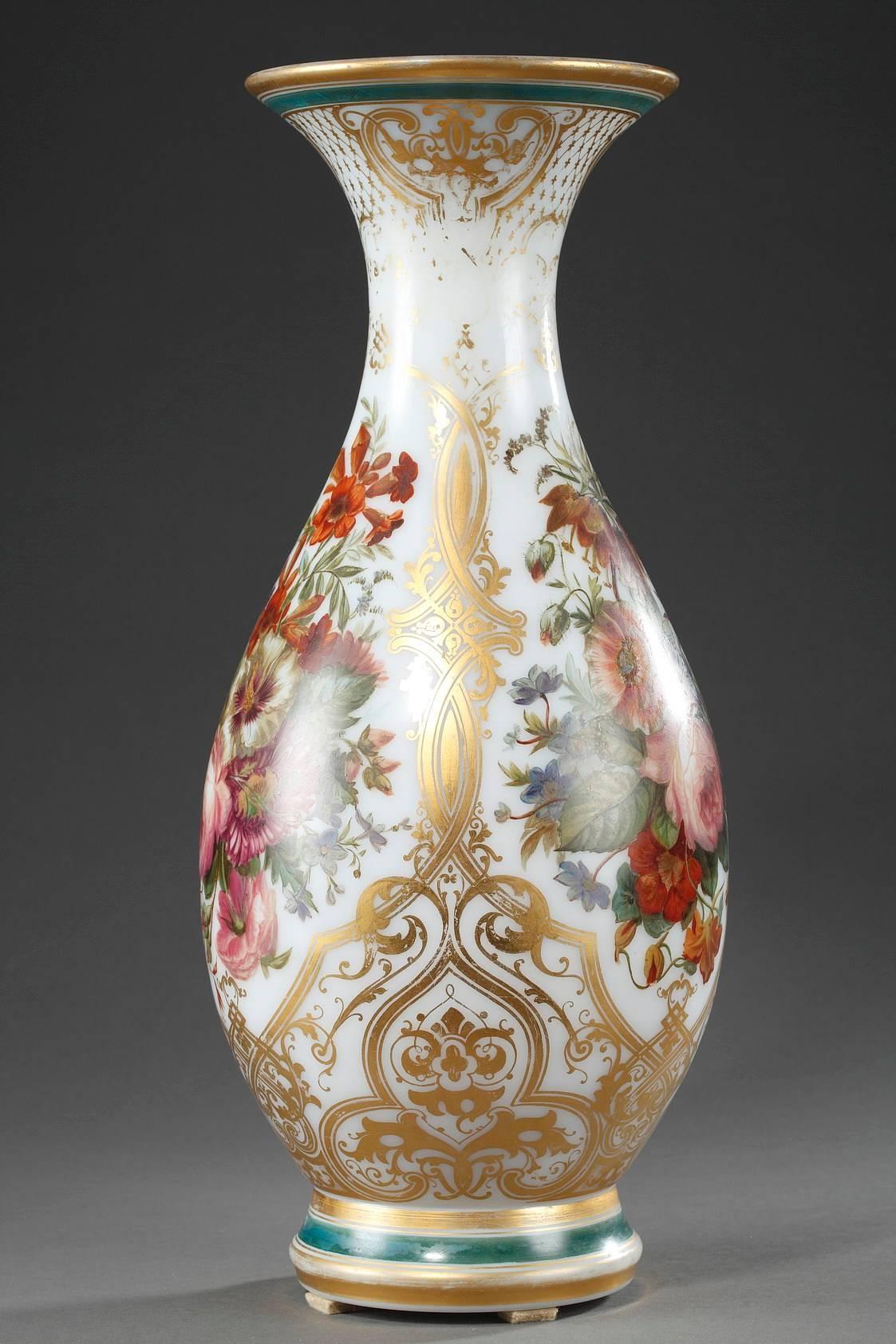 Baluster shaped vase in white, enameled opaline, with a multicolored decoration featuring bouquets of flowers on a white background. Gilded arabesques and latticework surround the bouquets, and the rim and base are decorated with broad, gilt and