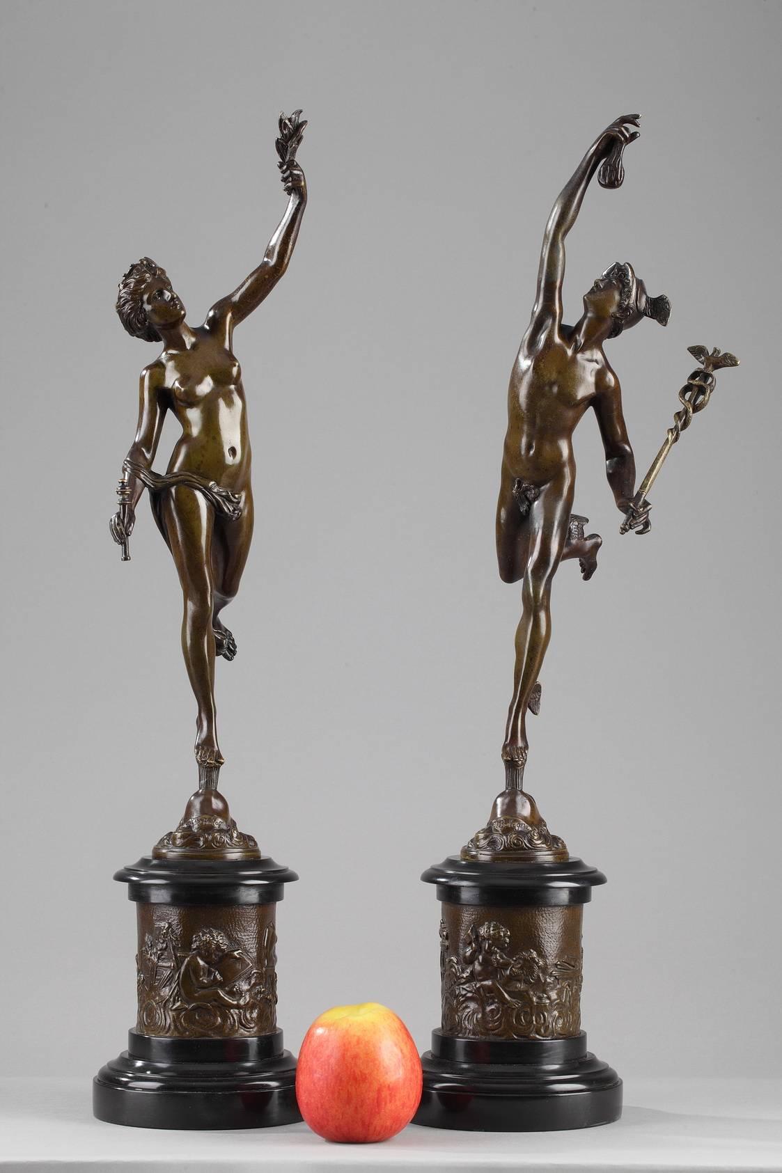 Two patinated bronze sculptures featuring Fortune, the goddess of luck and chance and Mercury, the god of good fortune in Roman mythology. Each divinity is represented with their symbols: Fortune is carrying grains in one hand and a scepter in the