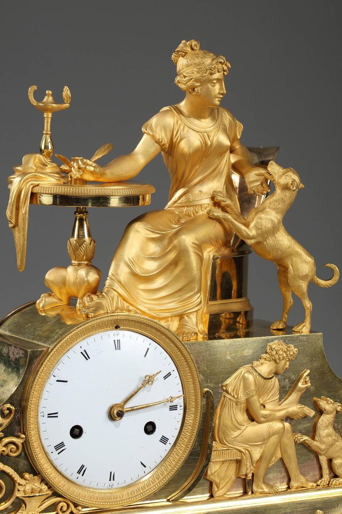 Early 19th century Empire gilt bronze mantel clock with allegorical scene depicting a young woman sitting at her work table playing with her dog, a symbol of loyalty. The pair is set above a raised case containing the dial. On one side of the dial