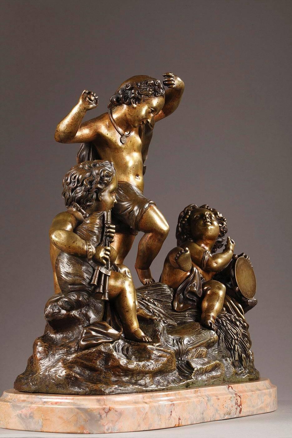 Bronze group representing three putti on a cliff strewn with wheat. Two of the cupids are playing the drum and bagpipe while the third one dances. The dancing cupid is wearing a flowing cloth while playing the castanets. The set is resting on a