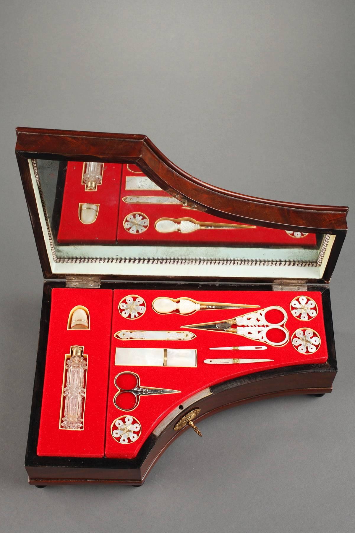 Mahogany sewing box in the shape of a grand piano, with a hidden music box. Inside the box is a set of beautiful mother-of-pearl sewing instruments fitted into red velvet.

In the 18th century, the notion of toiletry essentials or the 