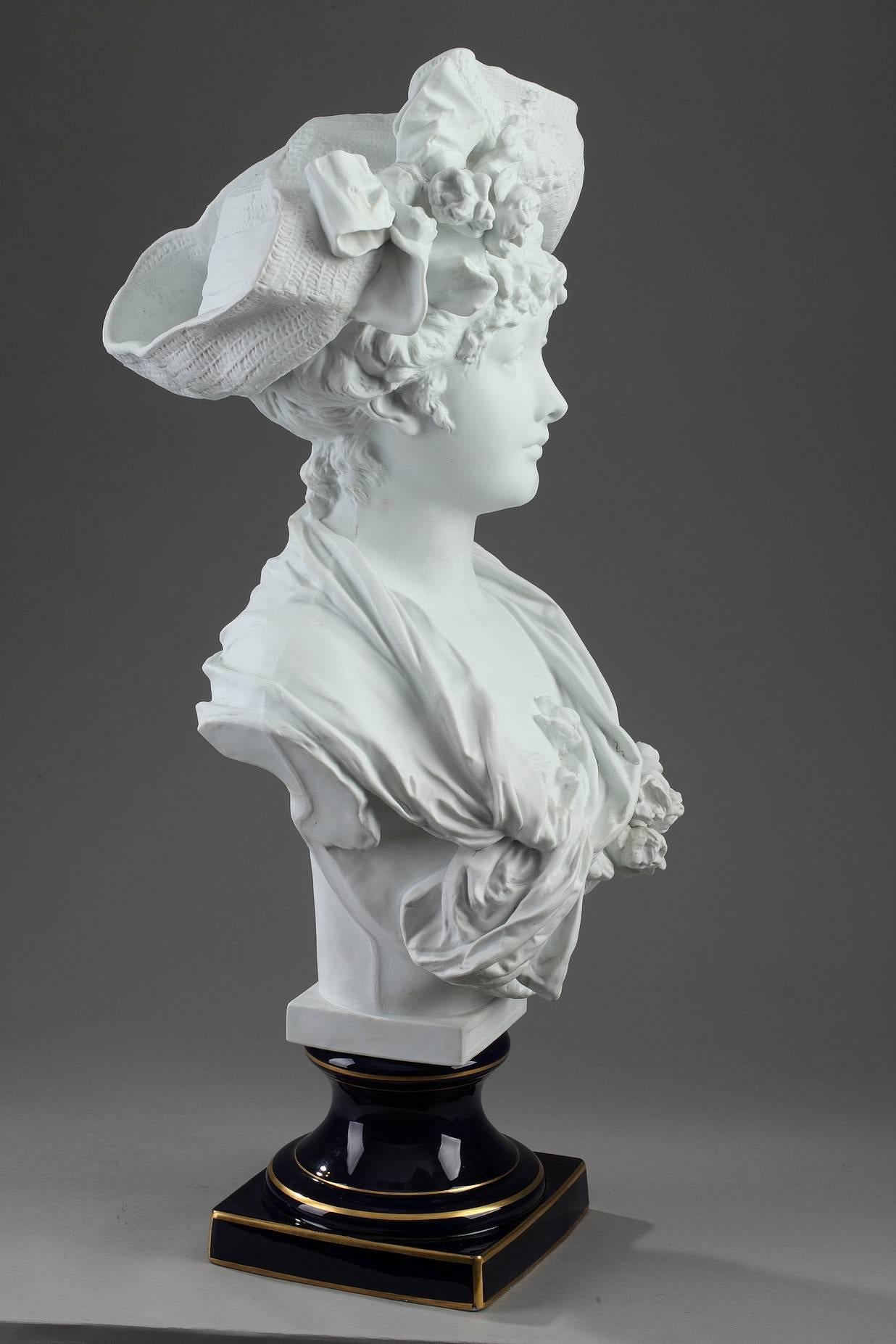 Late 19th century porcelain biscuit bust of a woman after Albert Ernest Carrier-Belleuse (1824-1887) and produced by the Laporte factory in Limoges. She is wearing an elegant dress accented with roses and a hat embellished with bouquets of flowers