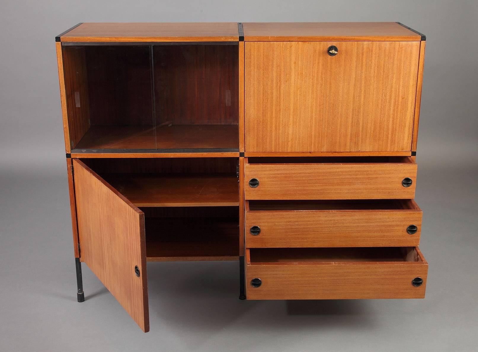 Modular teak buffet with three drawers and three containers, one with glass sliding doors, and two others with wood doors and one shelve inside. Designed during the 1950s by ARP (Atelier de Recherches Plastiques) a group composed of three designers: