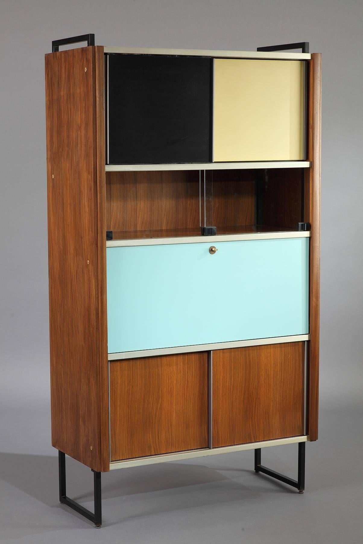 EFA secretaire bookcase in rosewood, aluminium and black laquered metal by Georges Frydman. It is composed of two containers and a s shelve with sliding doors in wood and glass. One container with a flap with a small drawer and several storage