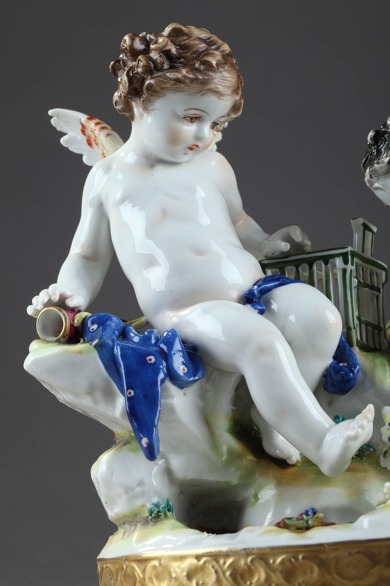 Two Ludwigsburg (Germany, Wurtemberg) hard-paste?porcelain?groups featuring two pairs of putti cherubs playing with birds and holding bunches of grapes, near a goat. Both groups with the blue crowned interlaced C mark of Ludwigsburg Porcelain