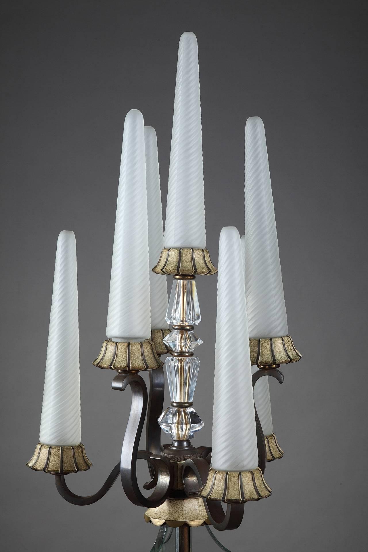 Exquisit lacquered bronze lampstand with seven twisted glass lights, resting on a high stem in Sevres crystal. Marked crystal GARANTI SEVRES FRANCE. Very good vintage condition, 


circa 1940
Dimensions: W: 15.7 in - D: 15.7 in - H: 76.8