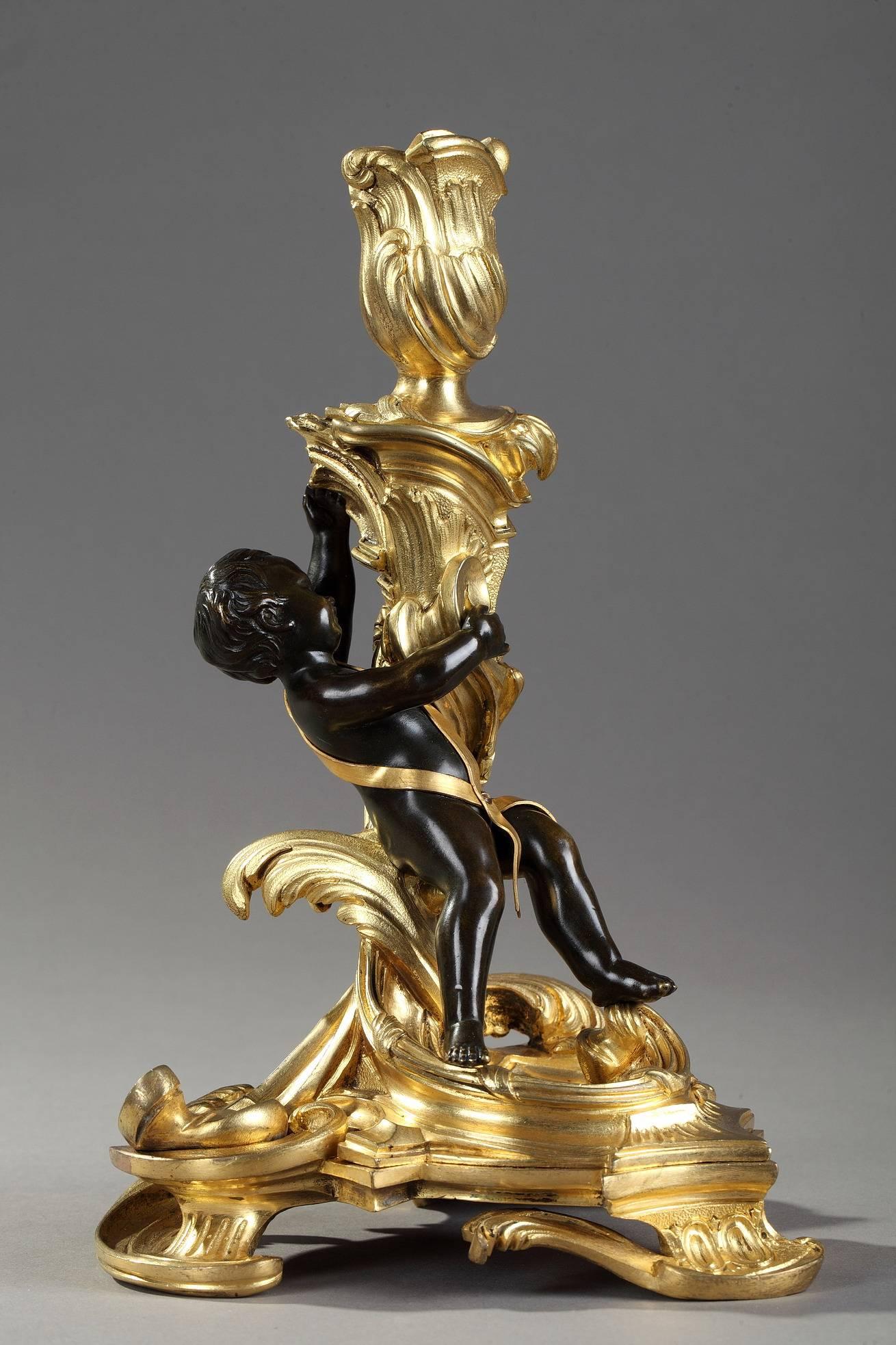 Rococo Pair of Gilt and Patinated Bronze Candlesticks after a Model by Meissonnier
