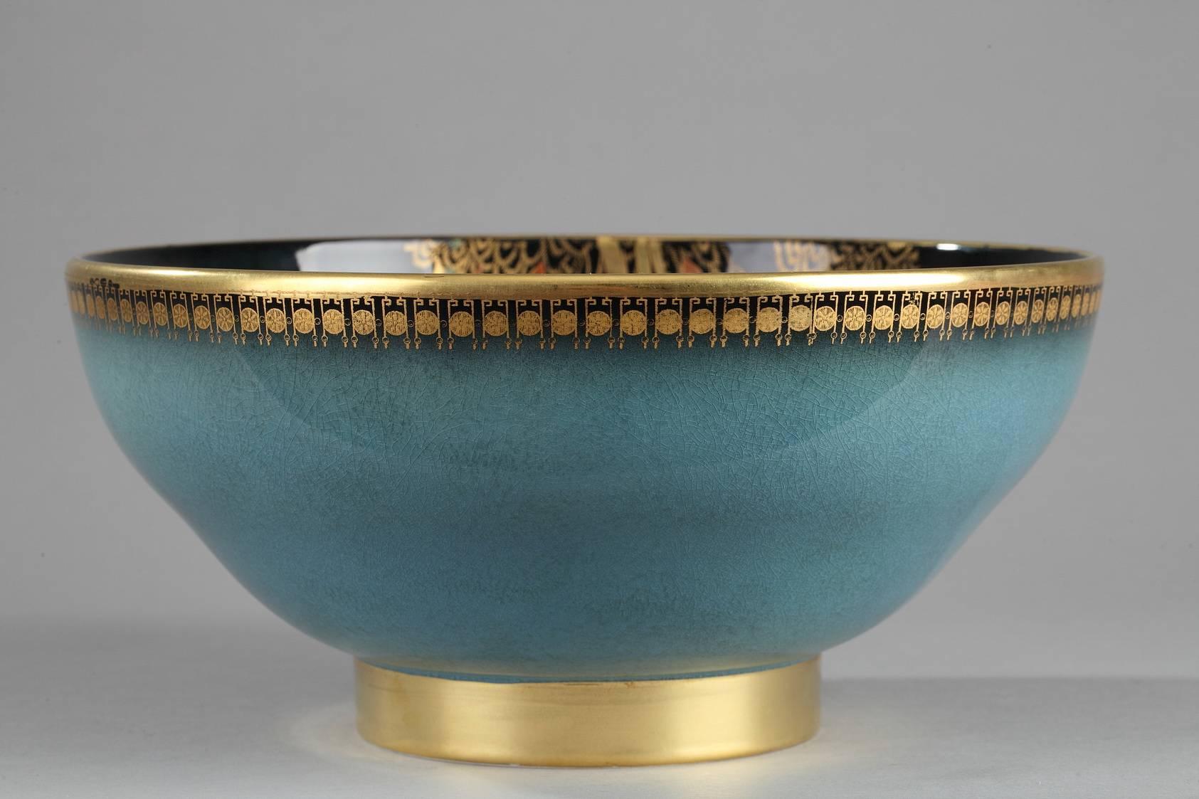 Large, multicolored ceramic bowl with gold accents embellished with a spider in its web, raspberries, butterflies, and foliage. Marked underneath: Carlton Ware, Made in England, Trade Mark, and Blue Royale. Marks used between 1926 and 1987.

circa