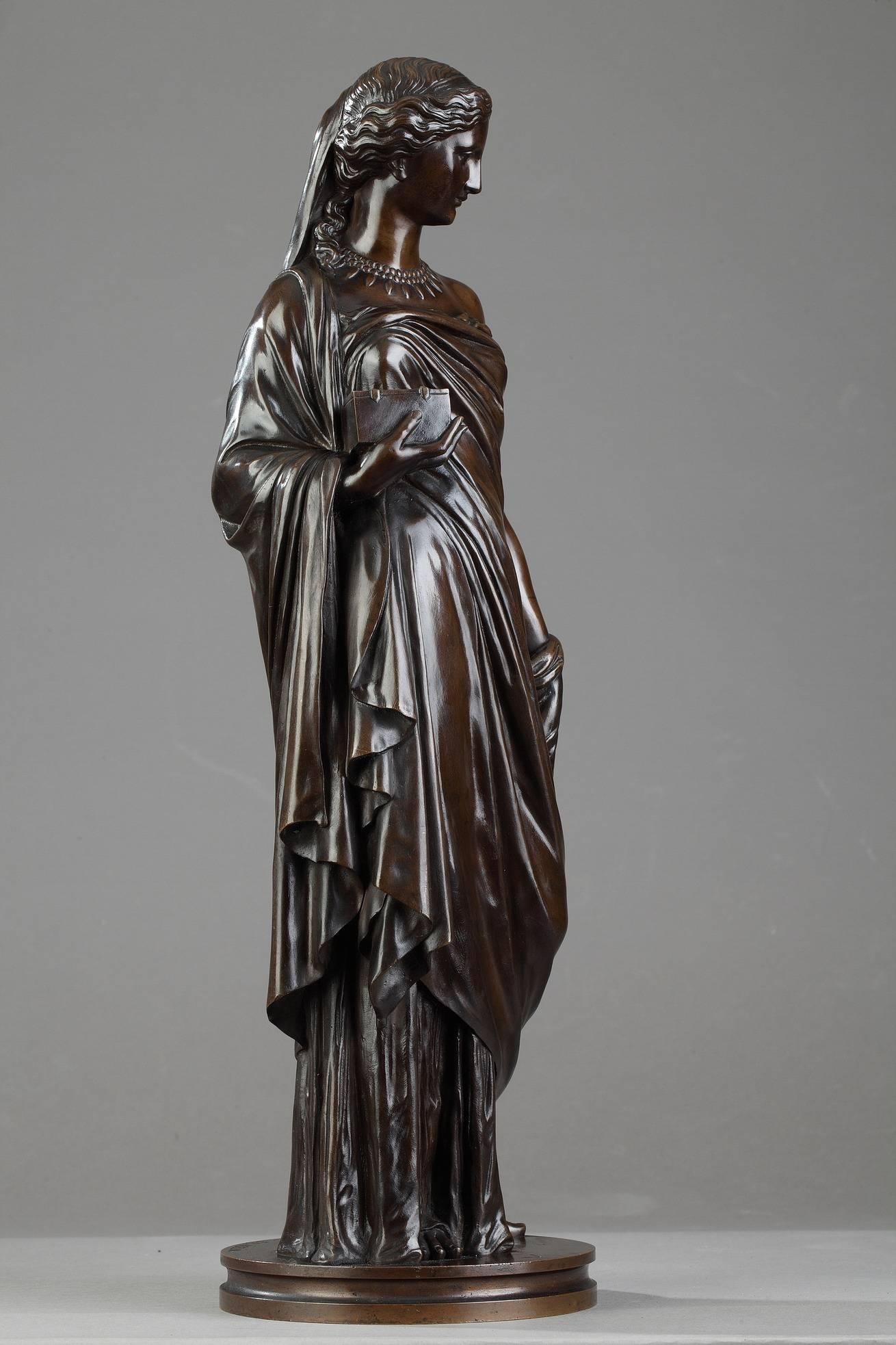 Late 19th century patinated bronze statue by Eugène Antoine Aizelin (1821-1902). It features Pandora in a standing pose wearing a flowing robe, holding a box close to her chest. Signed on the base: 