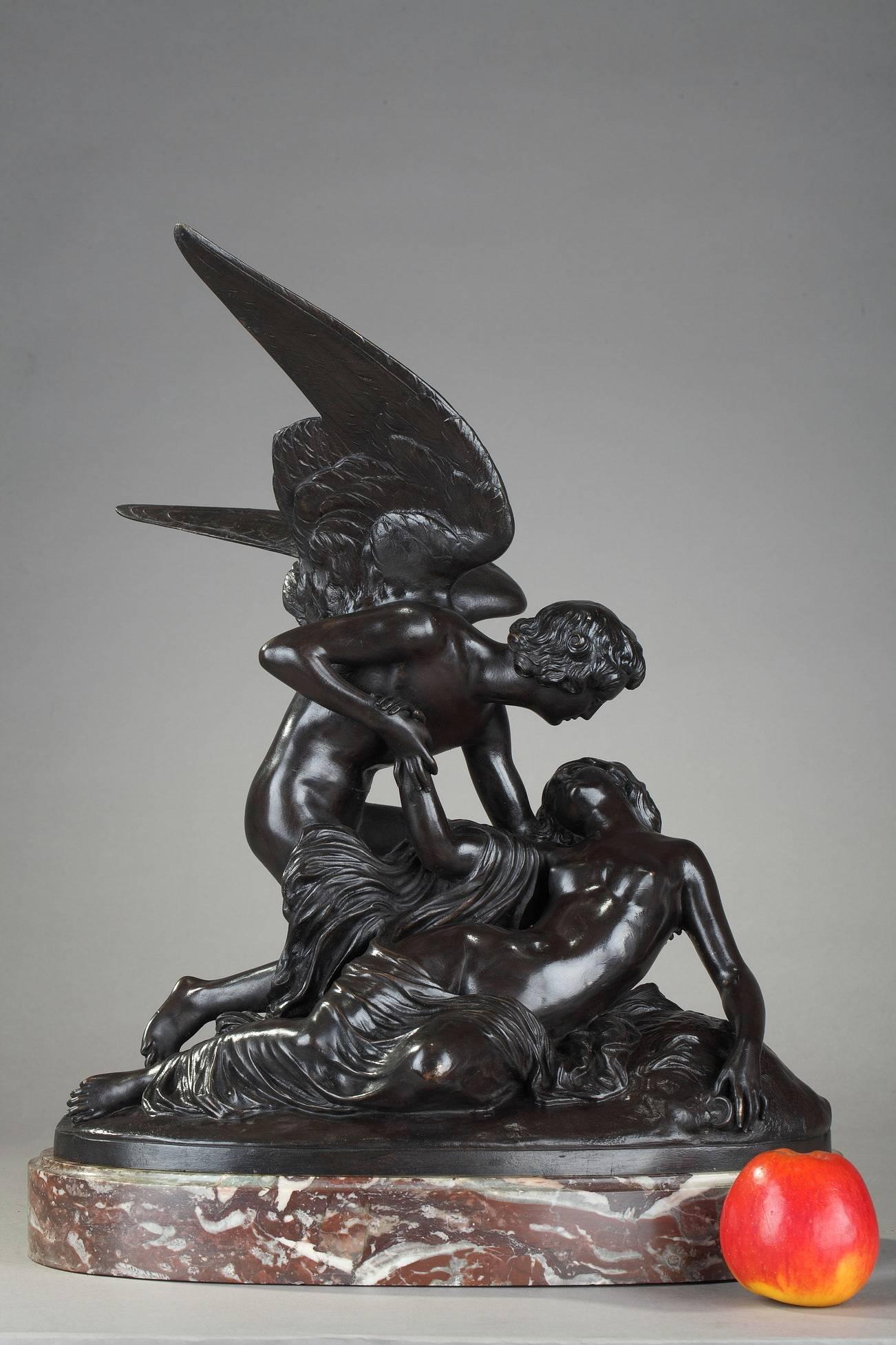 Bronze sculpture with brown patination after the famous group "Psyche Revived by Cupid's Kiss" by Antonio Canova (1757-1822). This winged young man who has just landed on a rock where a girl lies unconscious, is the god Eros (Cupid in