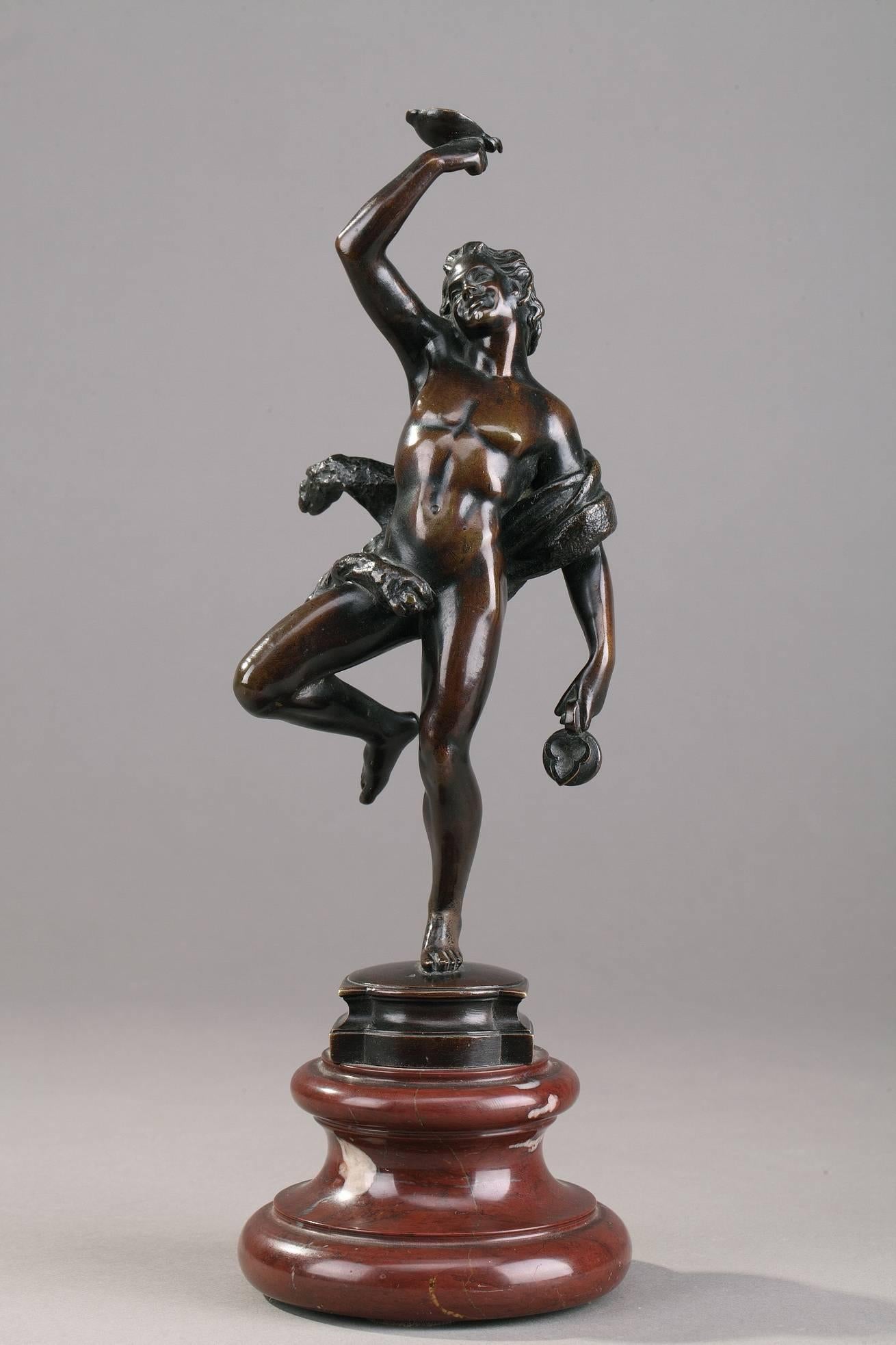 Pair of patinated bronze statues featuring two dancers from the procession of Bacchus (Dionysus), the god of wine, drunkenness, excess, and nature in Greco-Roman mythology. The young man holds the cup and the decanter whereas the woman plays the