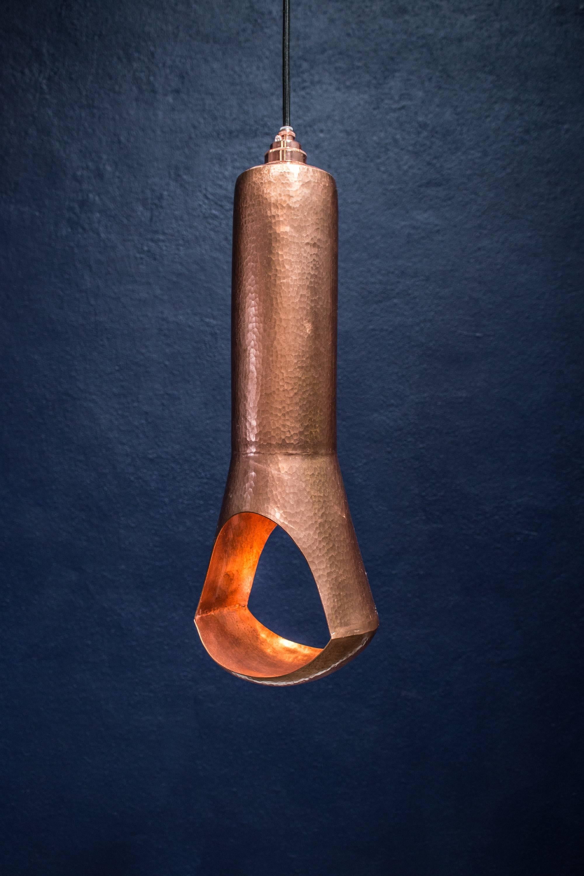 Custom hand hammered copper light made in Mexico. This light has a polished exterior finish, and polished brass interior finish. Take standard E26 bulb.

Kit comes with 1.5 meters of cable, fixture, canopy and LED light bulb. 