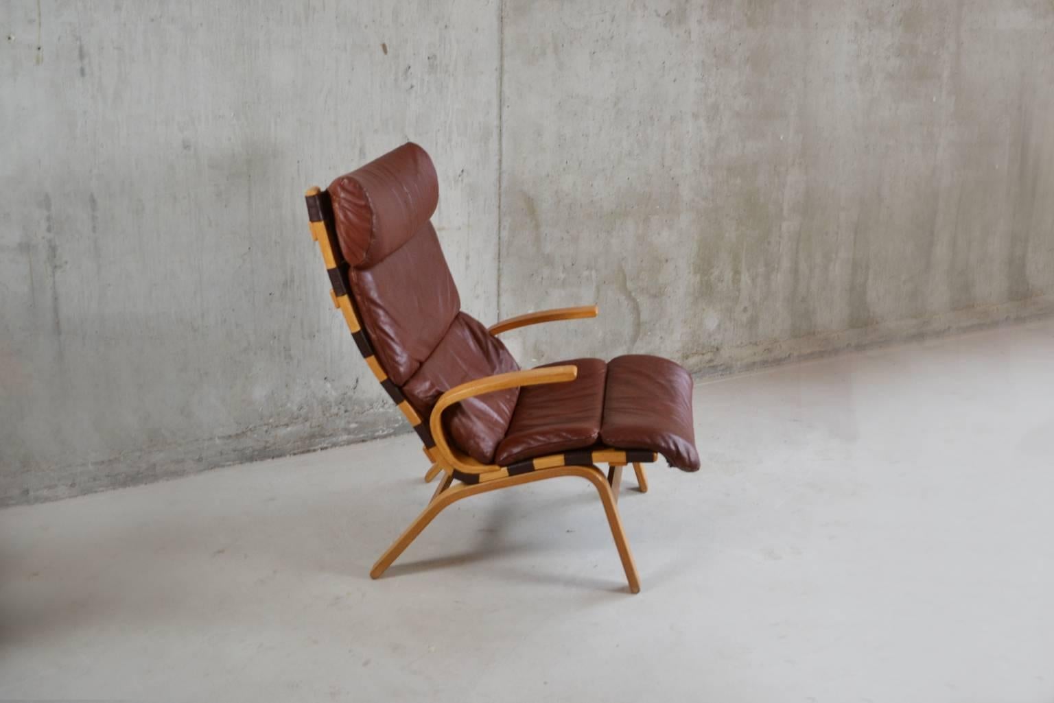 Stunning armchair by Farstrup of Denmark. A light beech frame and sumptuous reddish brown leather upholstery.

Designer: Unknown.
Manufacturer: Farstrup.
Material: beech and leather.
Country of origin: Denmark.
Size: 63cm wide x 93cm high x