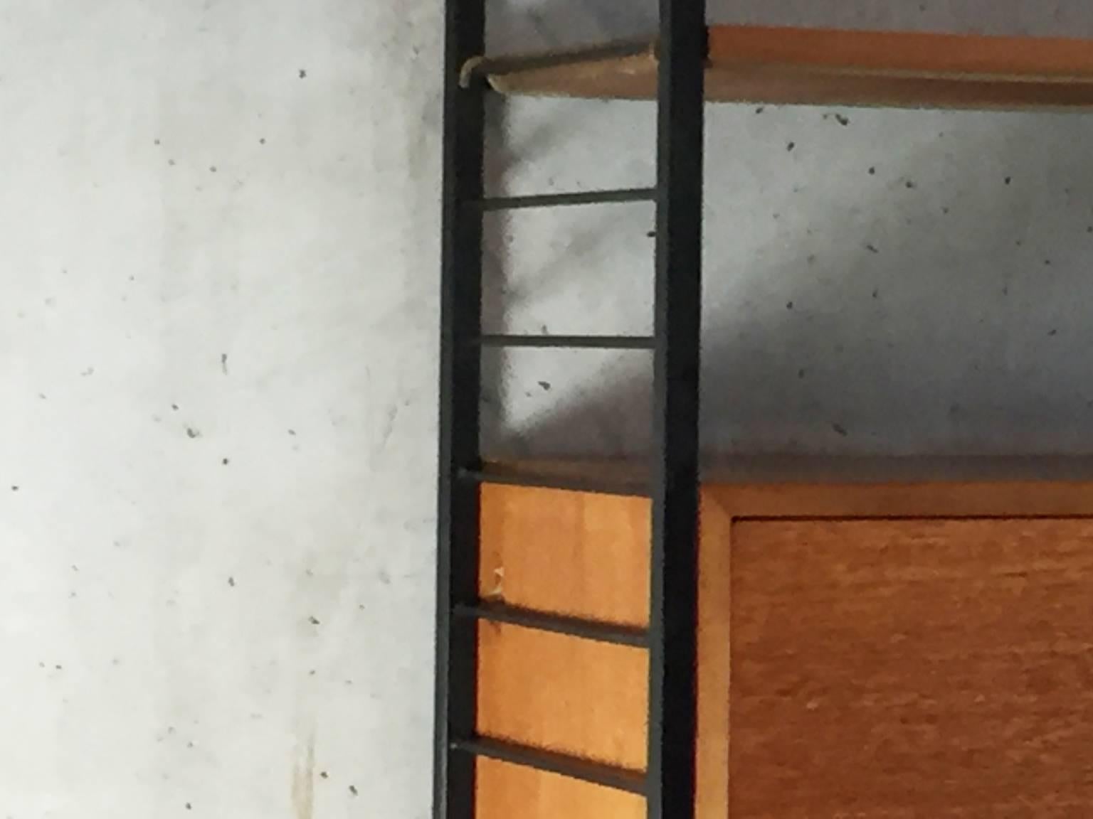 Iconic 1960s Ladderax double bay wall unit by Staples. The Ladderax system was the perfect and revolutionary storage solution when it was launched in the early 1960s and enjoyed a great success. This very versatile adjustable shelving system