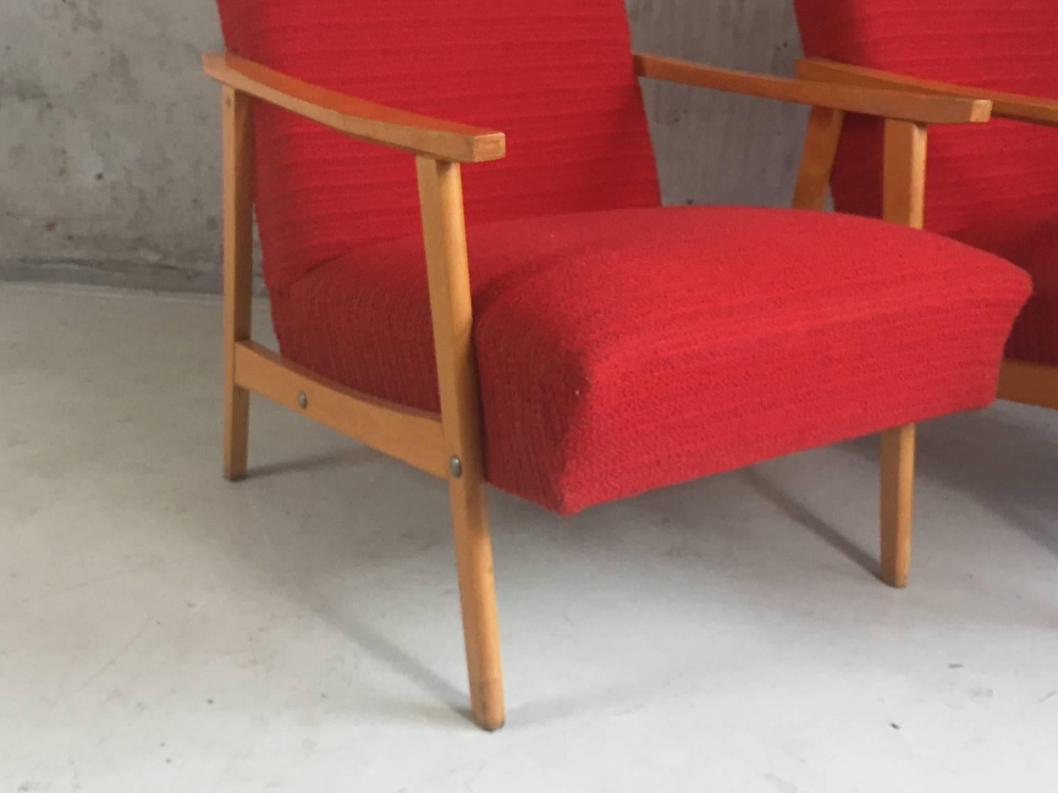 Very attractive pair of Mid-Century Modern lounge armchairs with a great shape and in fantastic condition. The wonderful brightly colored upholstery is original. Extremely comfortable.

The price listed is for the two chairs.
 