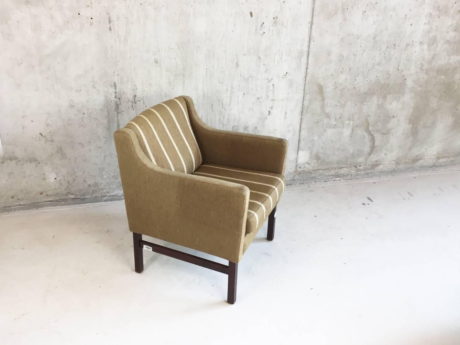 An elegant original Danish straight sided occasional chair or armchair with the original wool upholstery in good condition (some minor discolouration on the from of the arms). Supported on a stained beech base.
                     