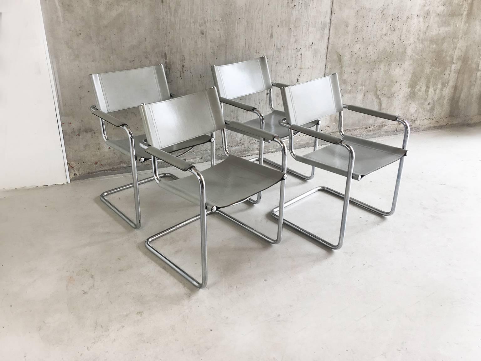 A set of four Classic MG5 chairs with thick belt leather seating, and hi gloss tubular chrome-plated metal frame.
Leather back embossed with 