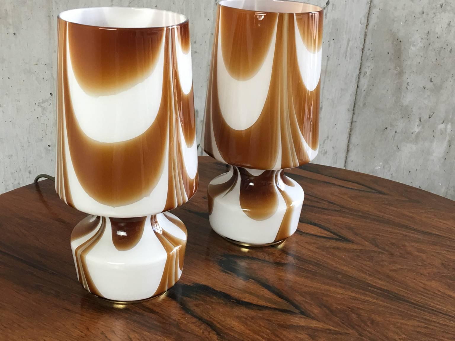 Super cool pair of Mid-Century Modern glass shade lamps with swirled brown pattern on white, sitting on brass base.

The price listed is for the two lamps.
 