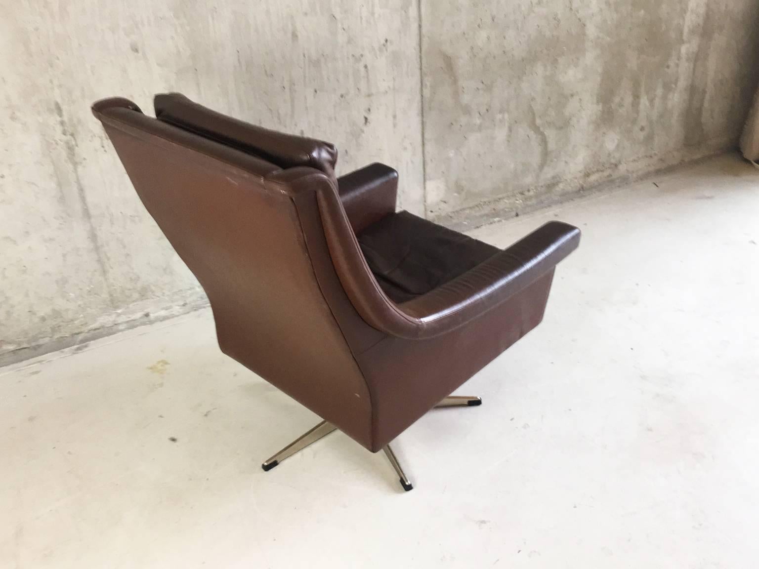 Plated 1960-1970s, Danish Mid-Century Brown Leather Reclining Swivel Armchair For Sale