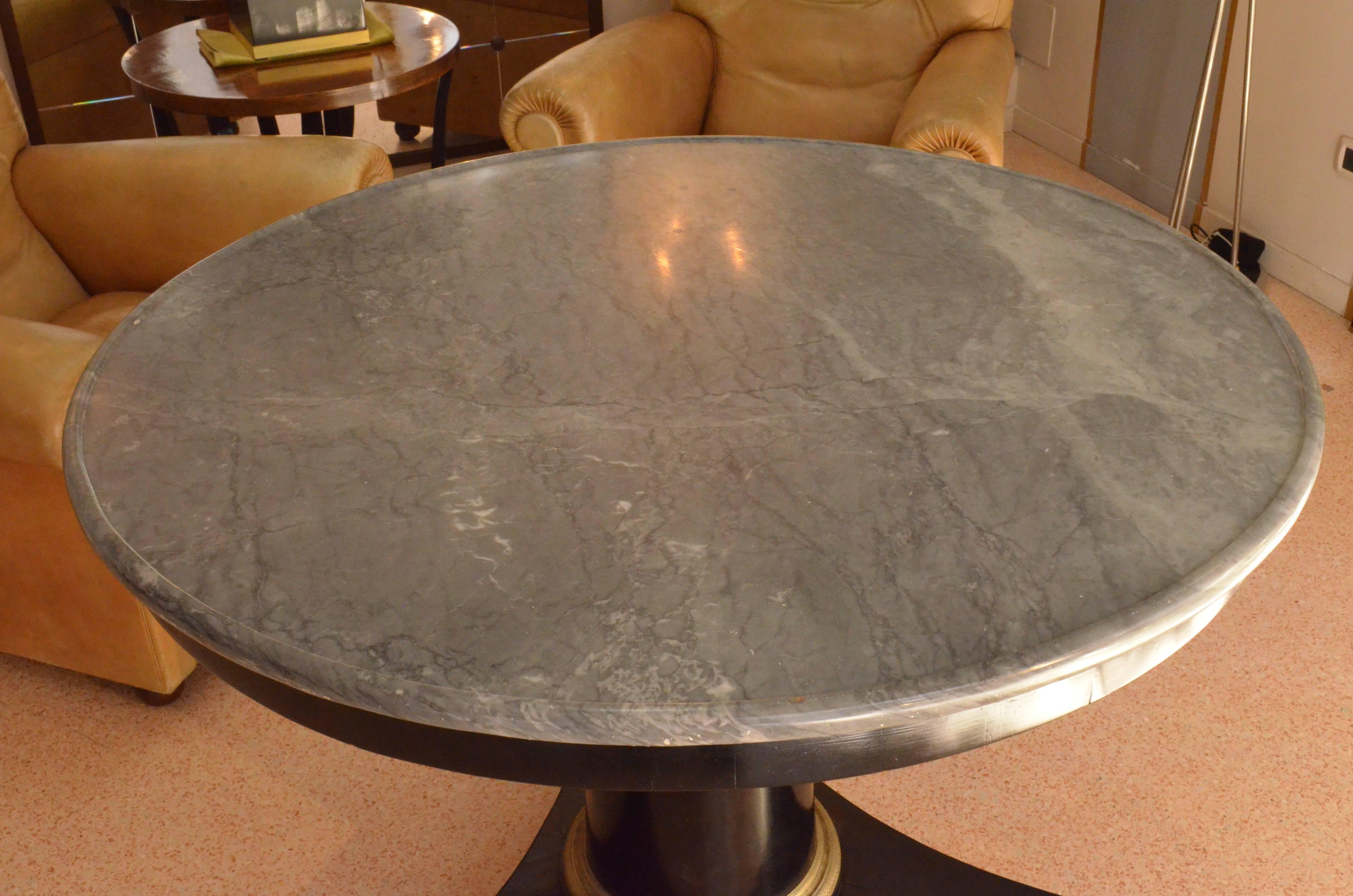 This unique marble-top table is from Italy from the early 19th century from Piemonte region. It features its original Bardiglio marble in excellent condition.
The central leg is in walnut wood ebonized with an original golden bronze finely engraved