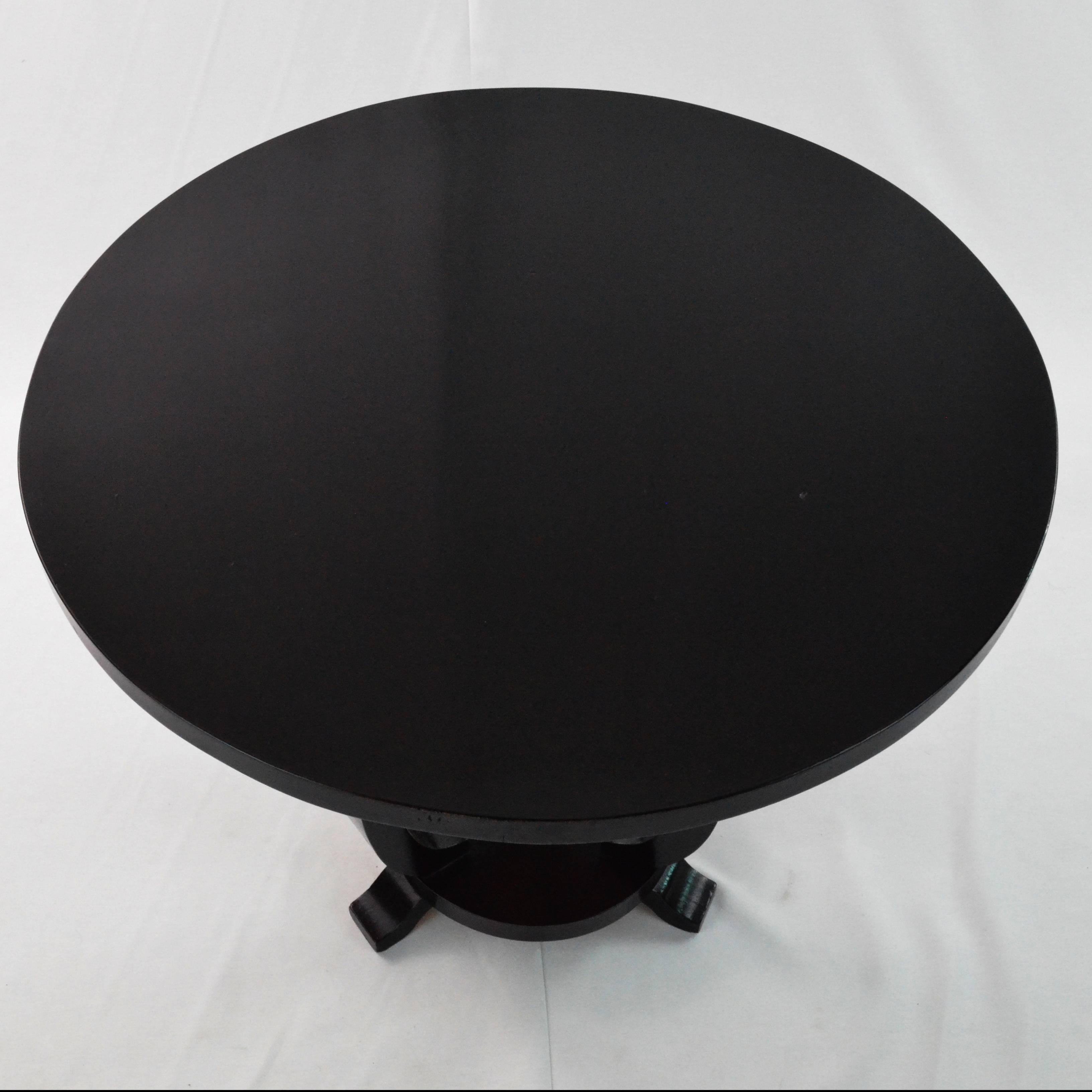 Ebonized Art Deco gueridon small table. From France from early 20th century. It needed only conservative restoration. This kind of table is like a passe-partout it is easy to place both near a sofa as sofa table and as a bedside table in bedroom.

