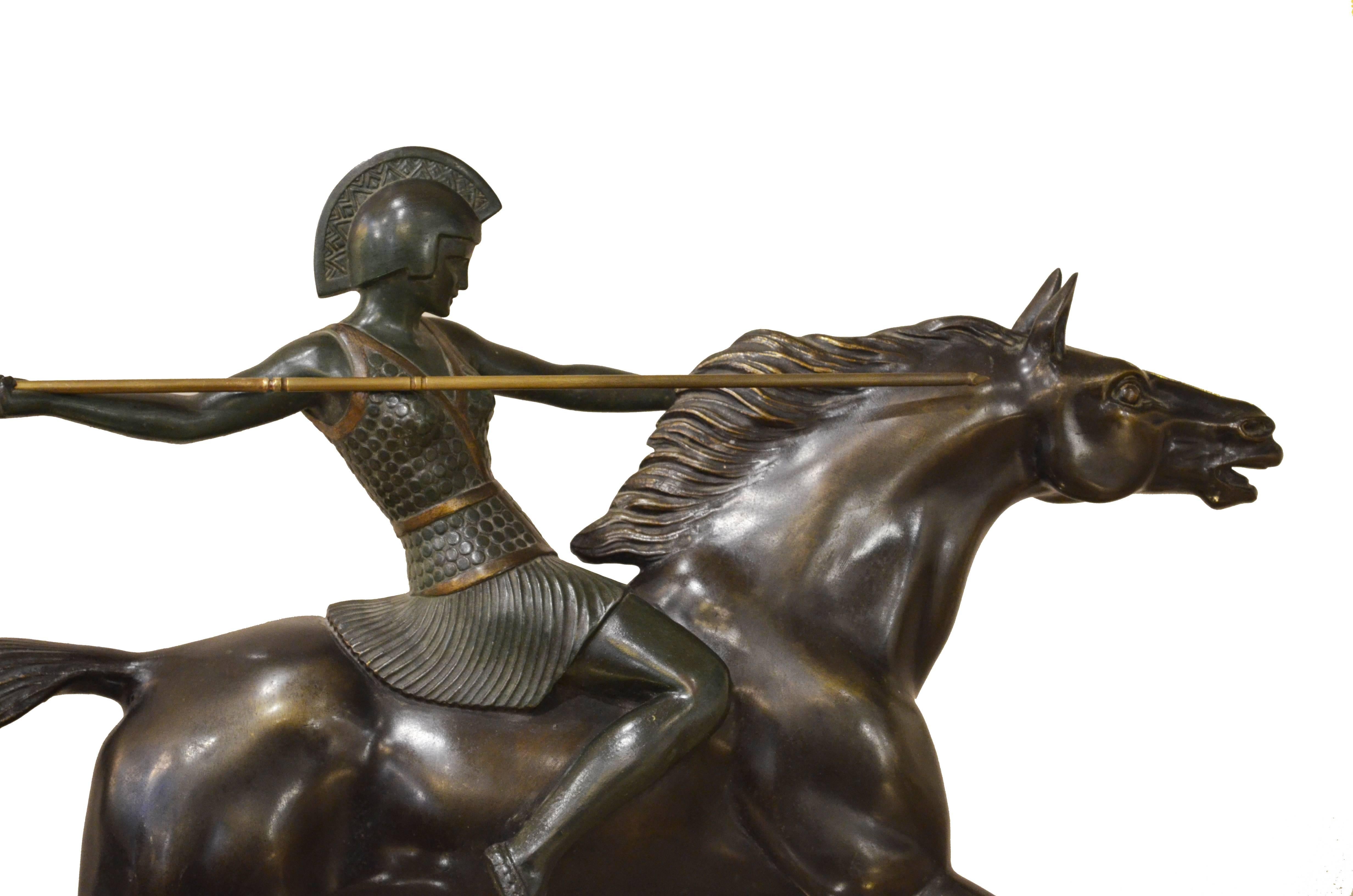 Amazon riding a horse ready to shot the arrow represented in a bronze sculpture on a marble base. This piece comes with its original patina and in excellent conditions. It shows a signature 