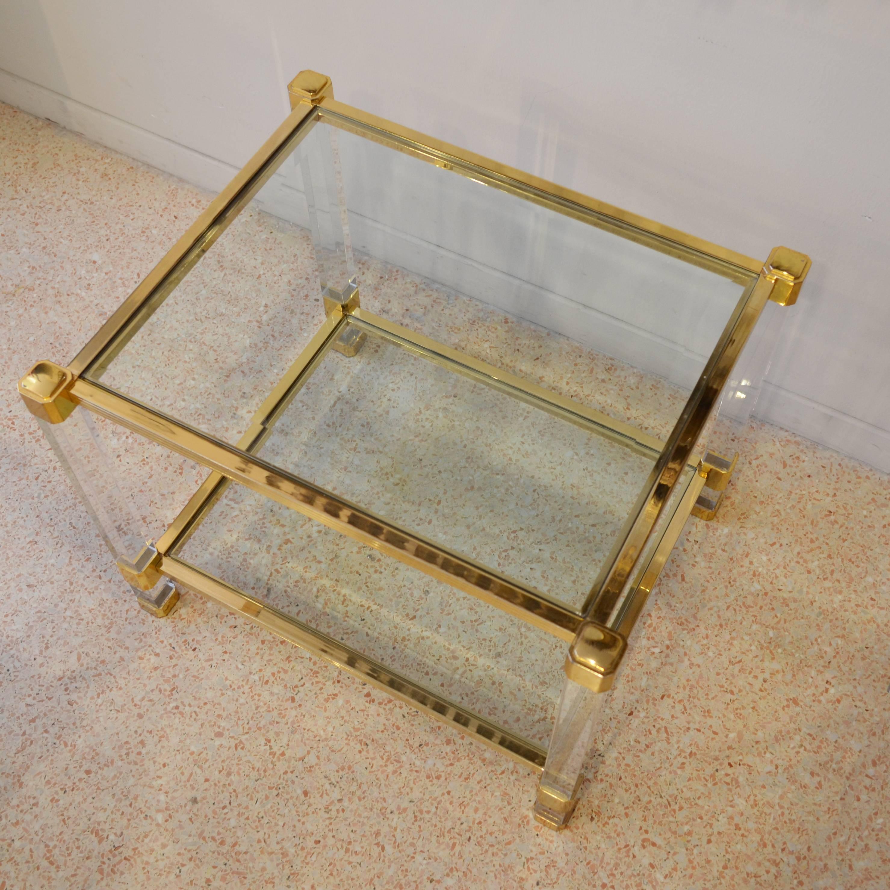 Parisienne table with structure made in brass and plexiglas and double crystal shelves.
Found in Paris, from 1980s in perfect conditions. Ideal to use as coffee tables or bedside tables.

To have a (fast and out of interest) shipment quotation,
