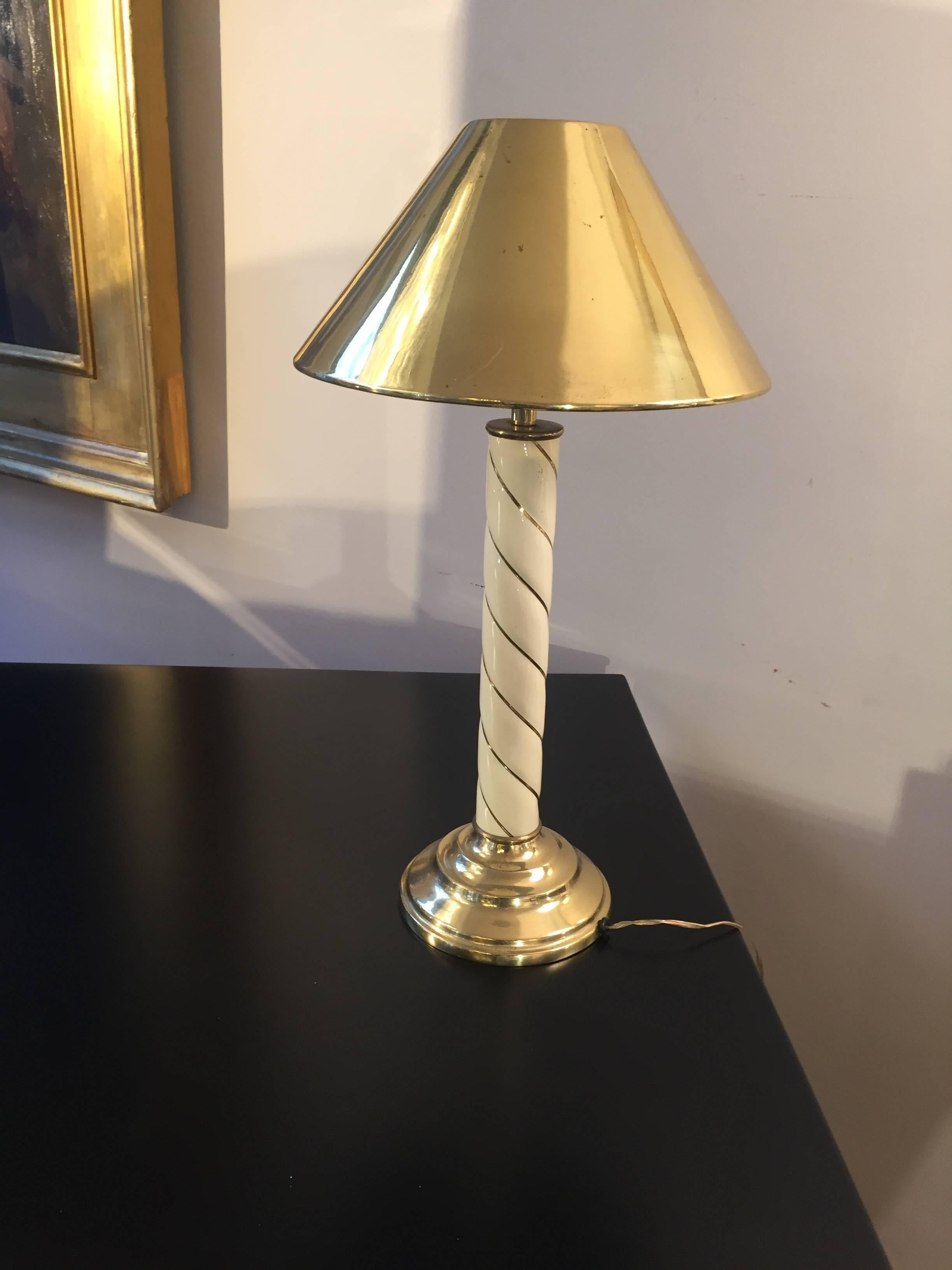 Small dimensions lamps with original brass lampshades. From Italy from 1970s attributed to Tommaso Barbi. The trunk is ivory-color resin and gold details. These small lamps (lampshade diameter 25 cm) are perfect for small spaces such as bedside