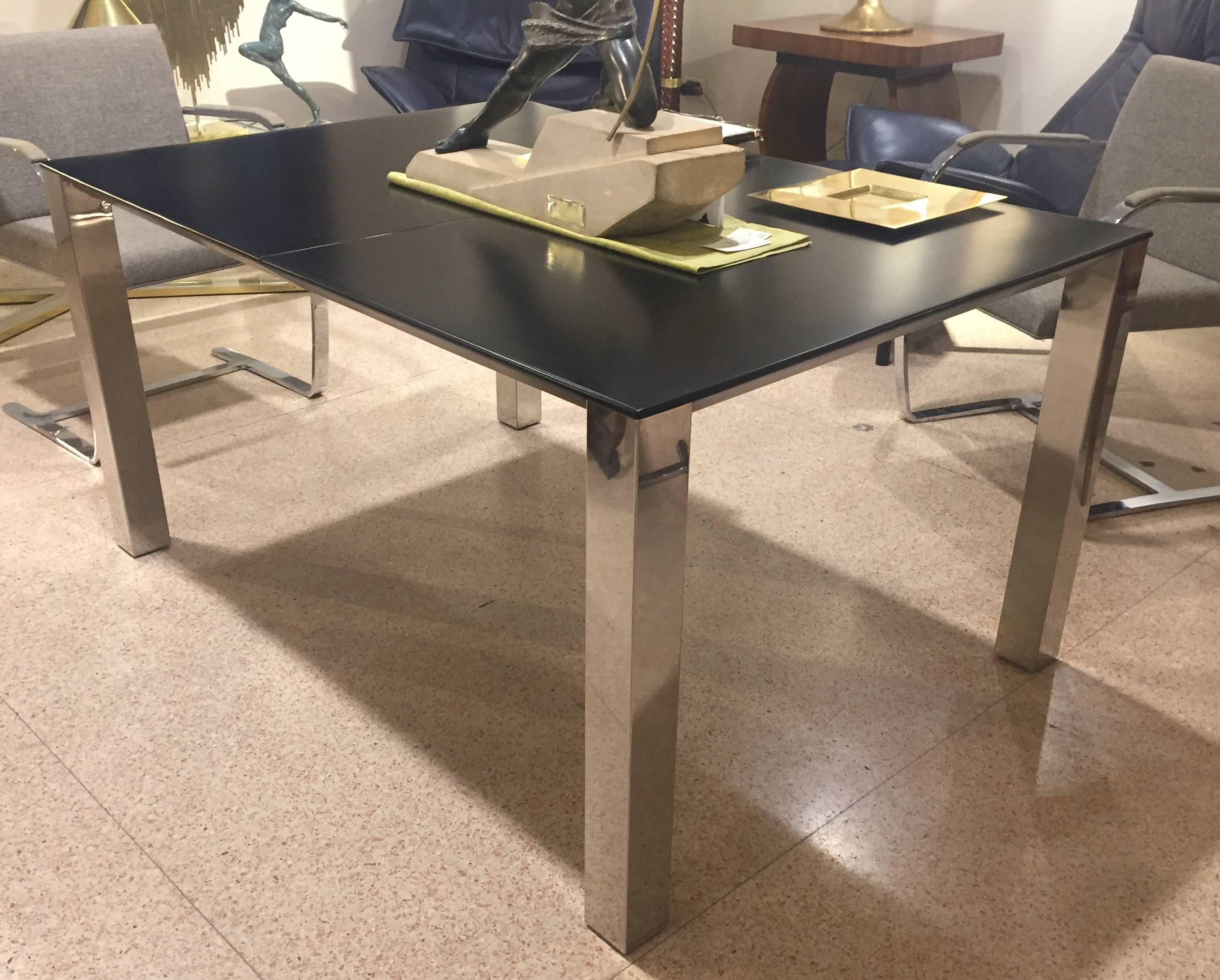Extensible table designed by Giovanni Offredi in 1960s and produced by Saporiti. The table features a wood top and chromed steel legs. It is extensible up to 200 cm. Size (closed) 140 x 100 cm, H 71.5
No restoration needed.


 