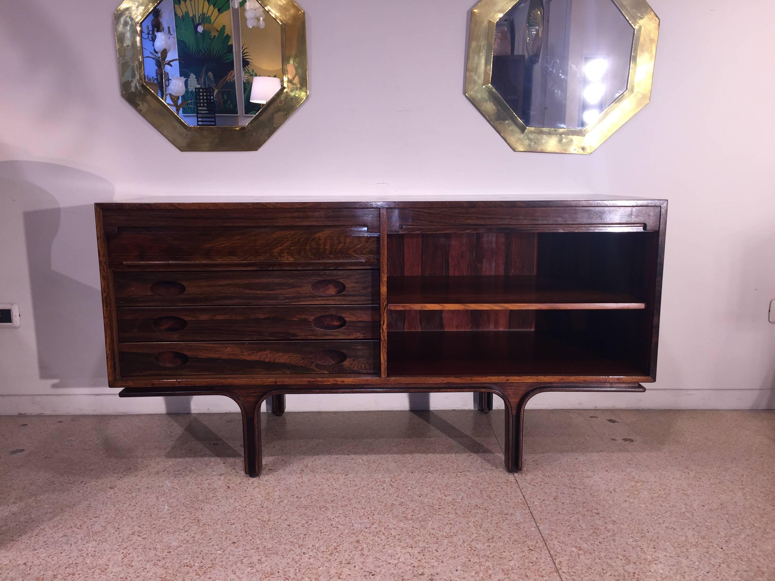 Original Italian elegant rosewood sideboard by Gianfranco Frattini, production Bernini since 1956
Serie 550.  Two section closed by rolling shutter. A shelf in one section, drawers on the other section. This piece is suitable to be placed in the