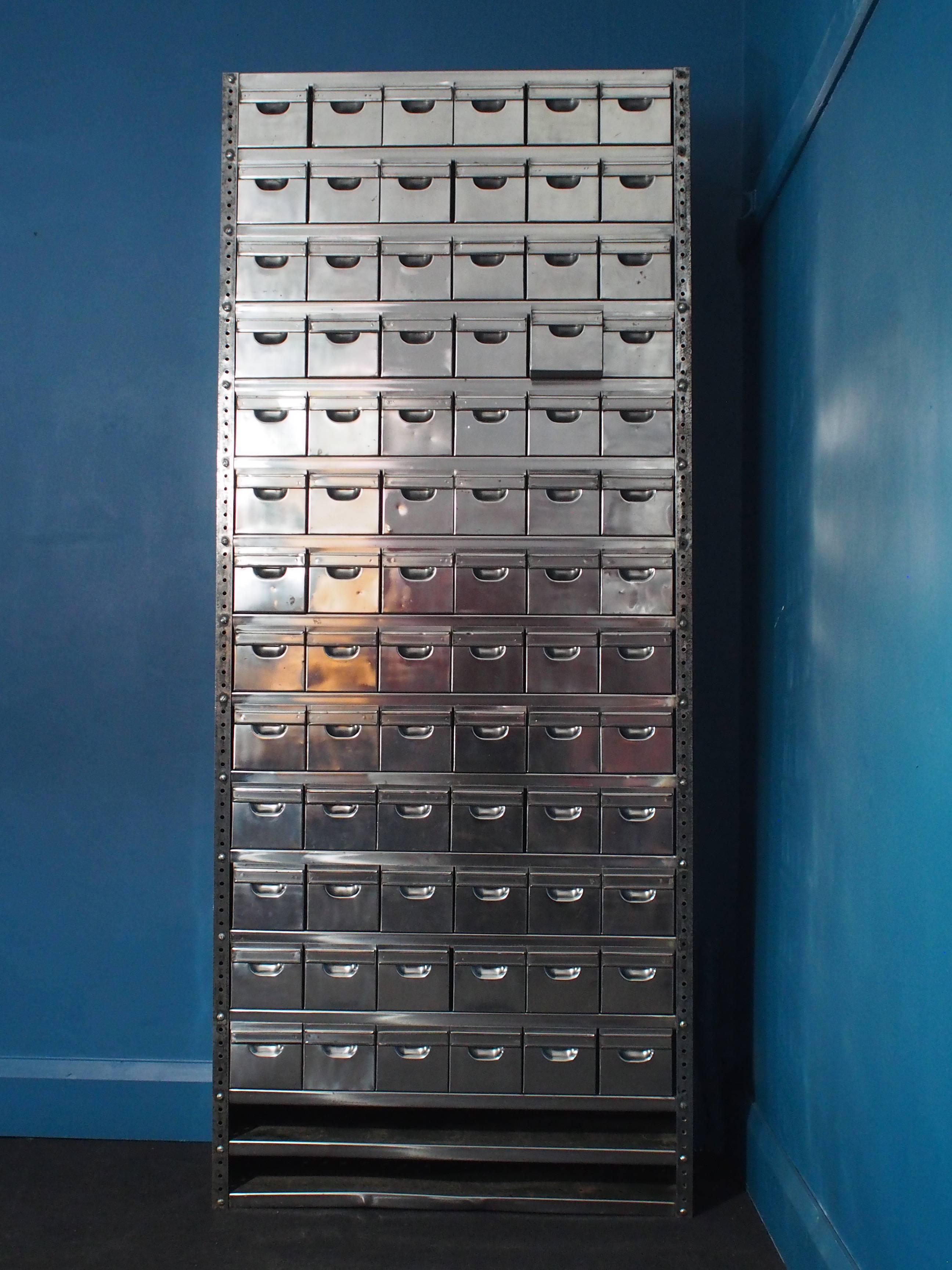 This vintage Industrial storage unit was produced during the 1950s in Nantes, France. Made from solid steel and containing 78 individual removable drawers and two shelves at the base, this unit offers multiple storage and display options.

Free UK