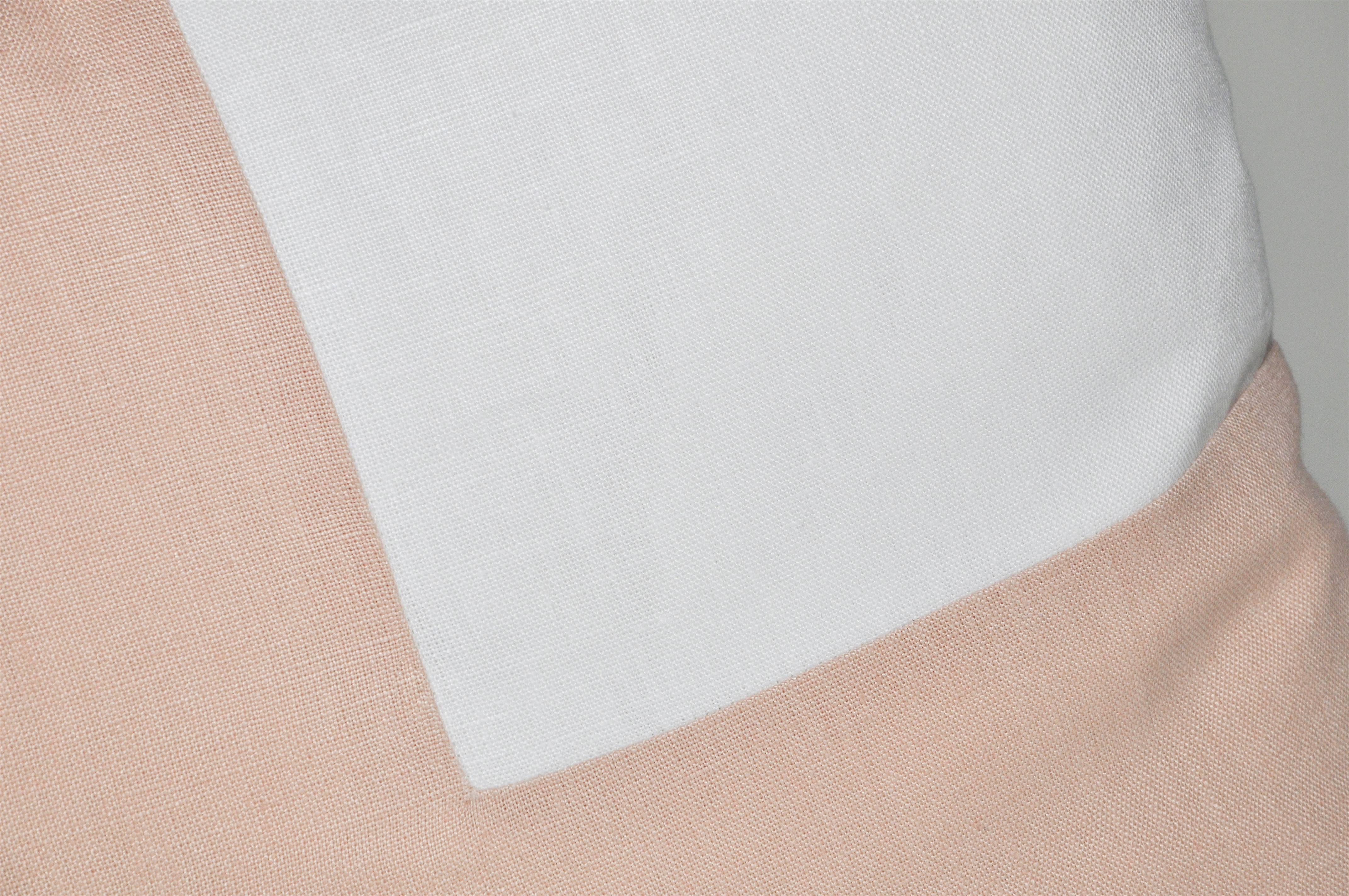 
A custom-made contemporary luxury cushion (pillow) constructed with vintage elements by using fragments of precious fabric. In a soft peachy nude light pink matched with classic pristine white from unused rolls both the colour and texture is