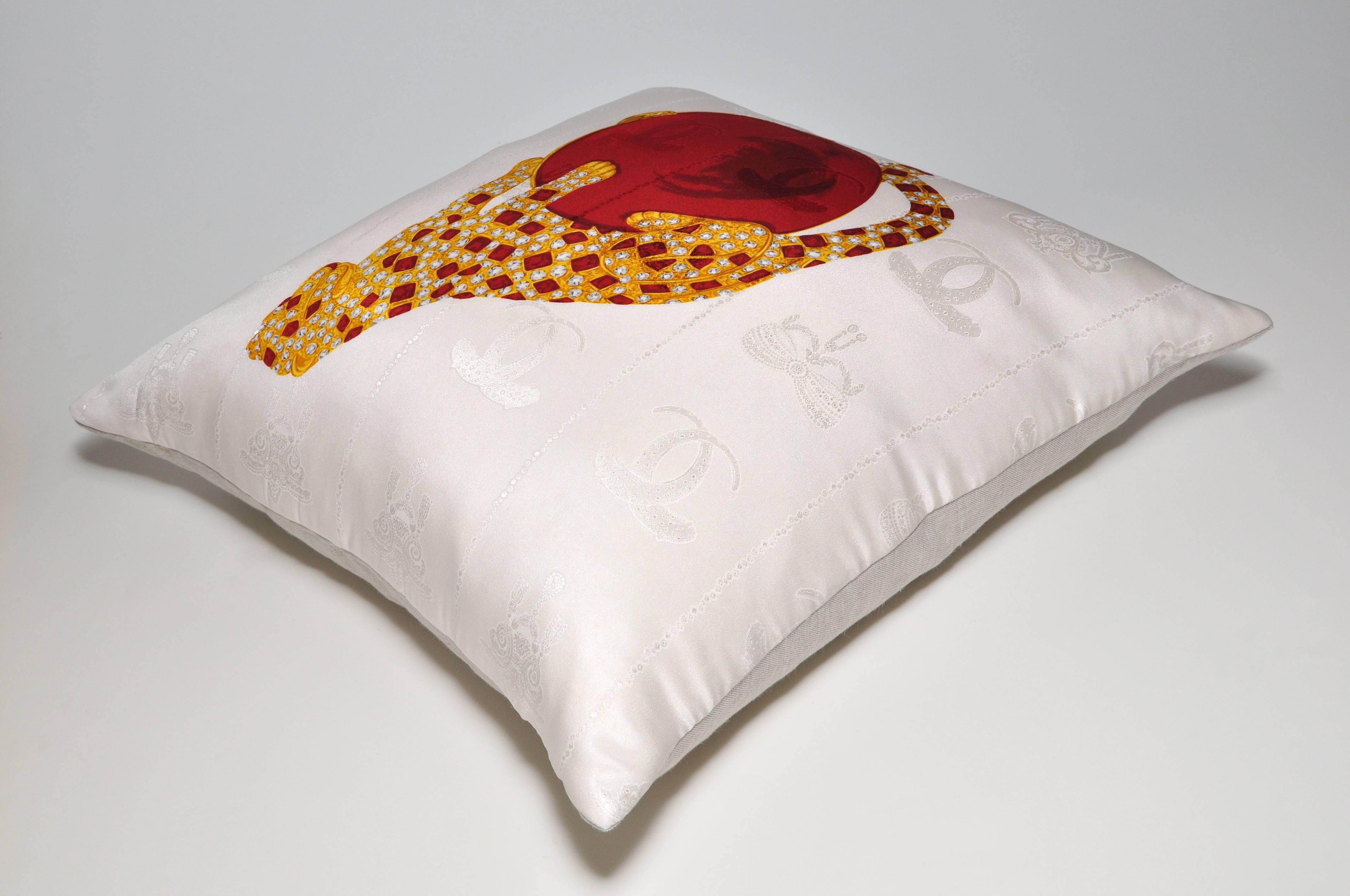 Large custom-made one-of-a-kind luxury cushion (pillow) created from an exquisite vintage pure silk Cartier fashion scarf in a striking bold design. It features their signature iconic Panther perched on top of a precious spherical ruby stone in a