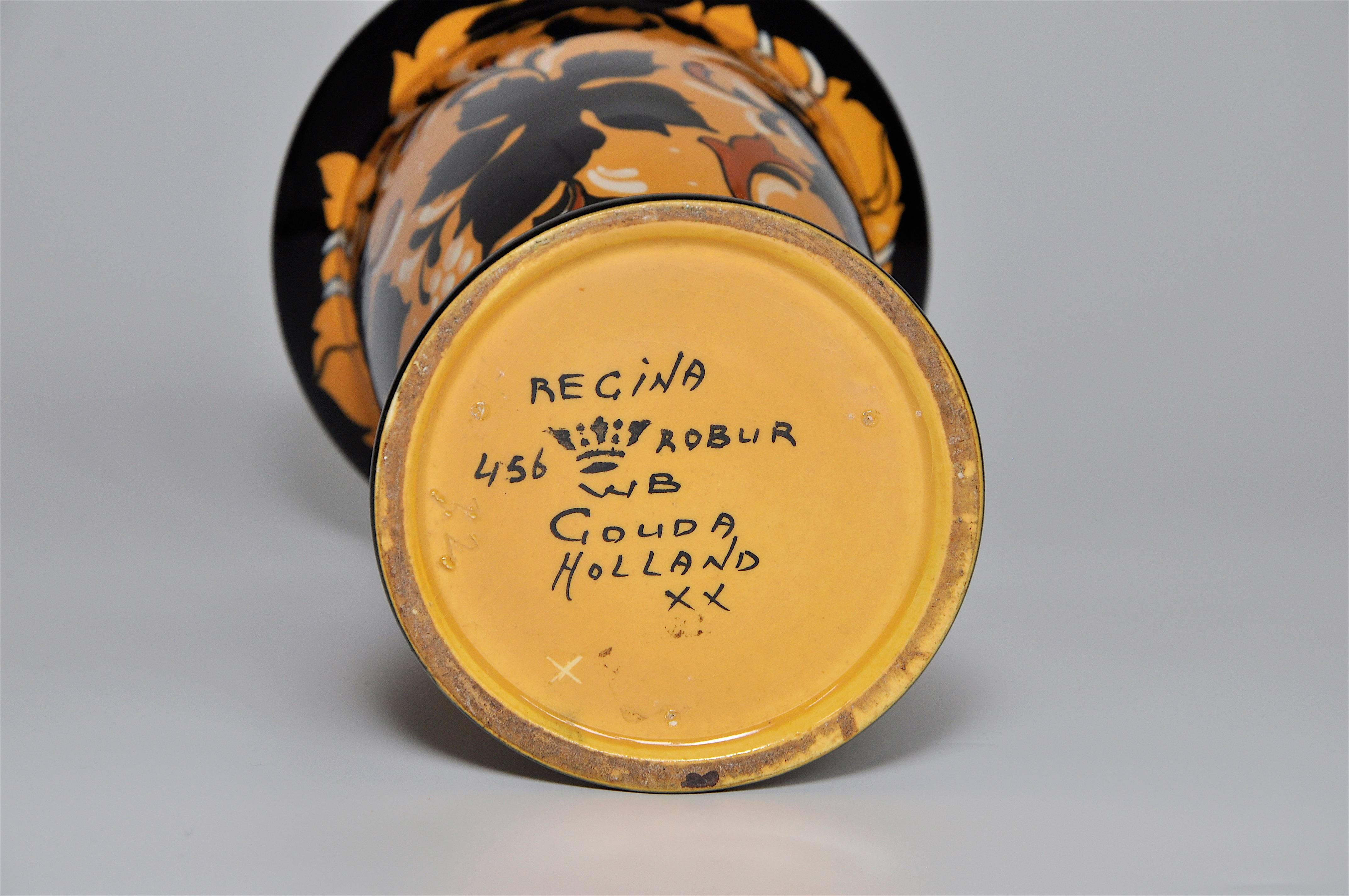 It has an elegant classical poise that is very unique. A sophisticated stylised Art Nouveau floral and leaf organic design with a high gloss finish. The body has a yellow ground with which the almost silhouette like pattern is painted. Both the