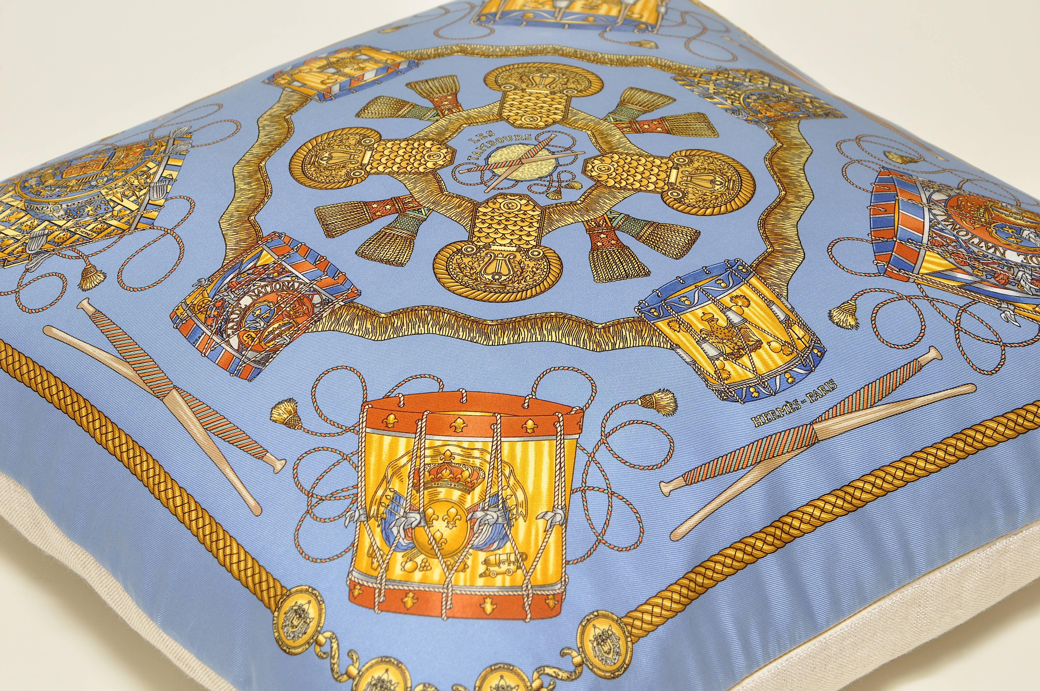 The ‘crème de la crème’ of scarves, this beauty is a one-of-a-kind custom made luxury cushion (pillow) from an exquisite vintage silk Hermes fashion scarf featuring an exquisite band design named ‘Les Tambours’ designed by Joachim Metz in 1989, in a