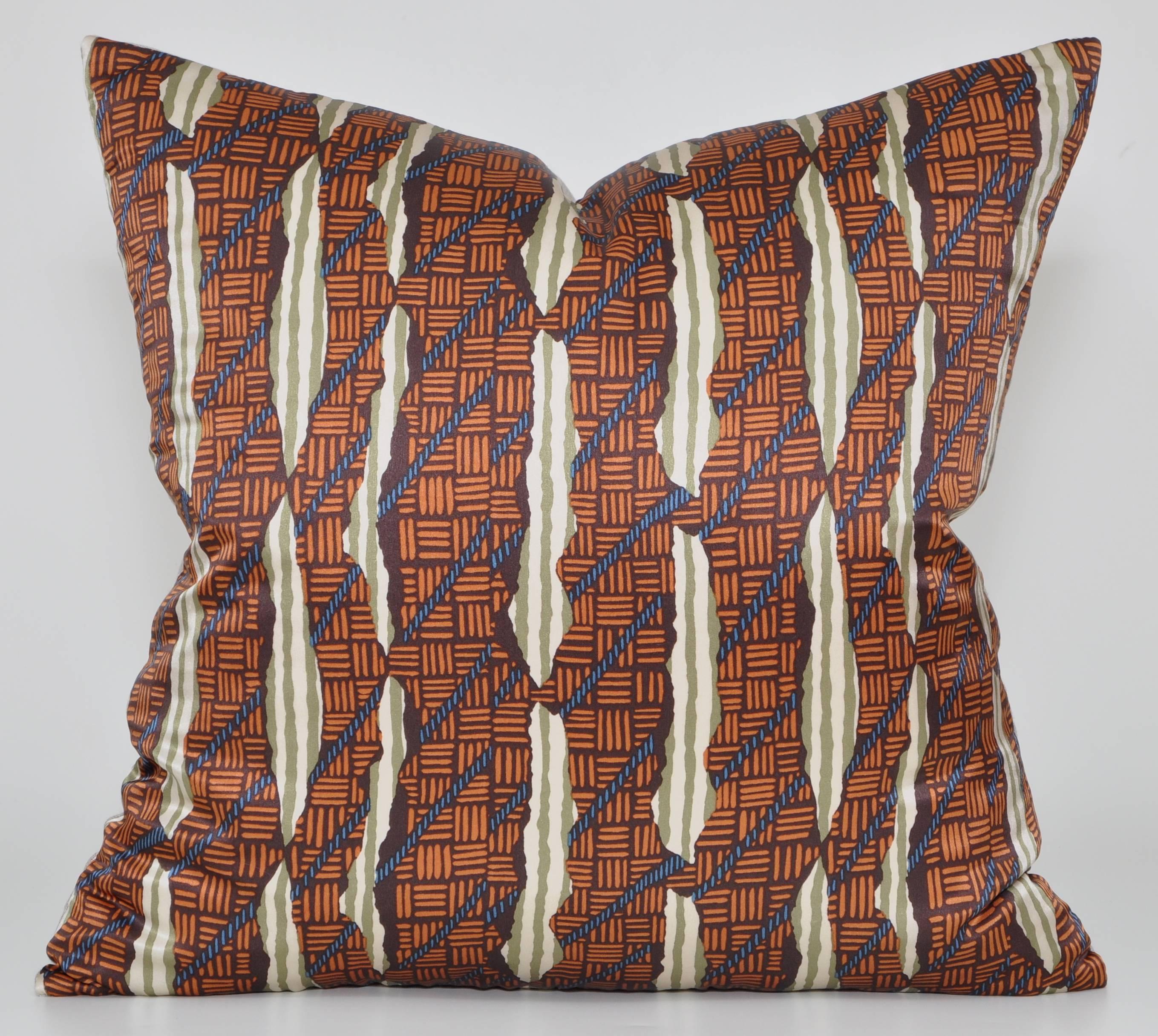 Fabulous plush luxury cushion (pillow) created from a sumptuous Liberty of London silk, beautifully soft to touch in an interesting and complex design. With elements resembling tears and rope, along with stripes and alternating markings, it appears