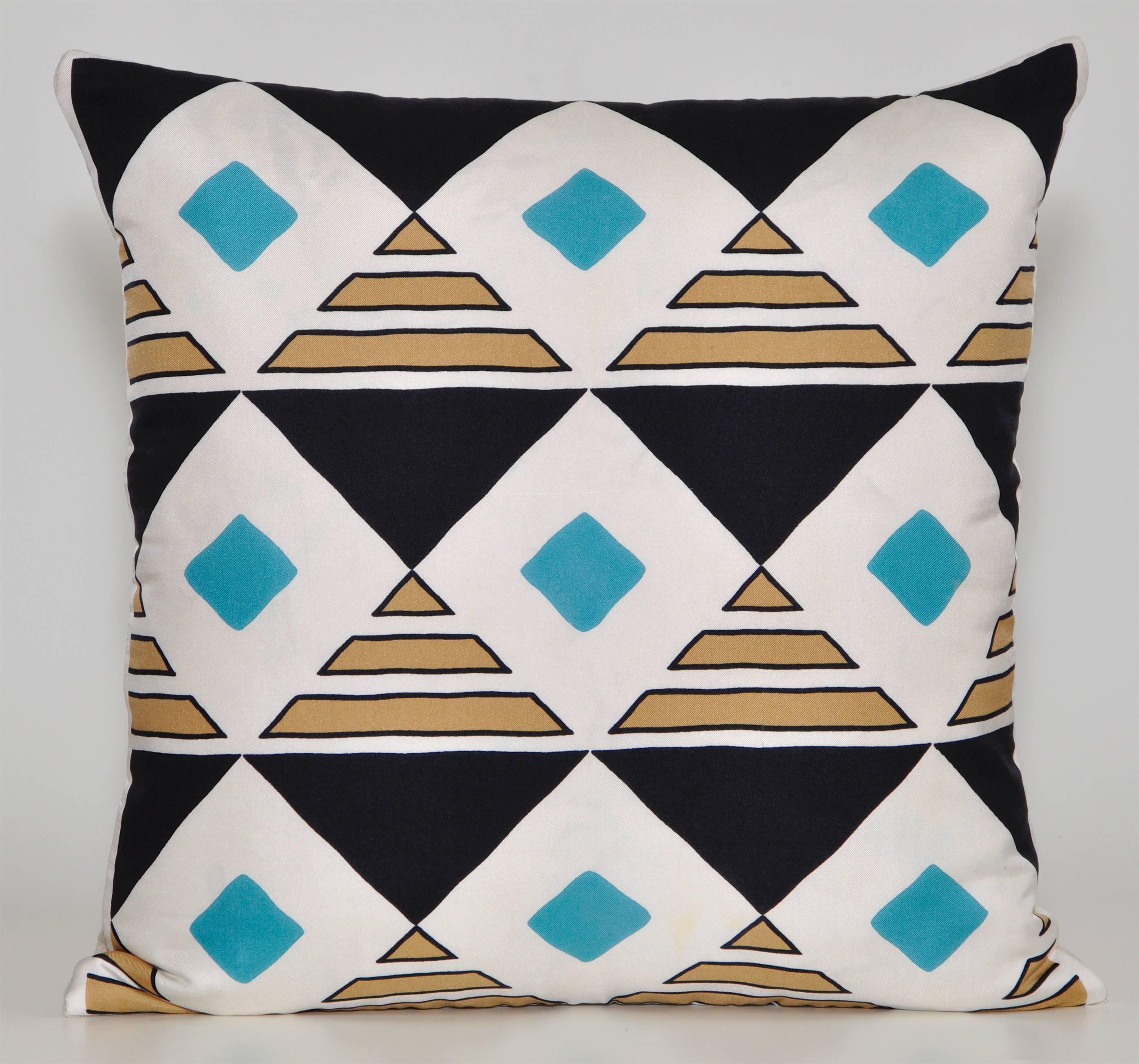 Custom-made pair of cushion created from a rare vintage silk Jacques Heim fashion scarf in a striking turquoise, white and black geometric pattern. Parisian born designer Jacques Heim began as a furrier in the 1920s in his parents' fur business,