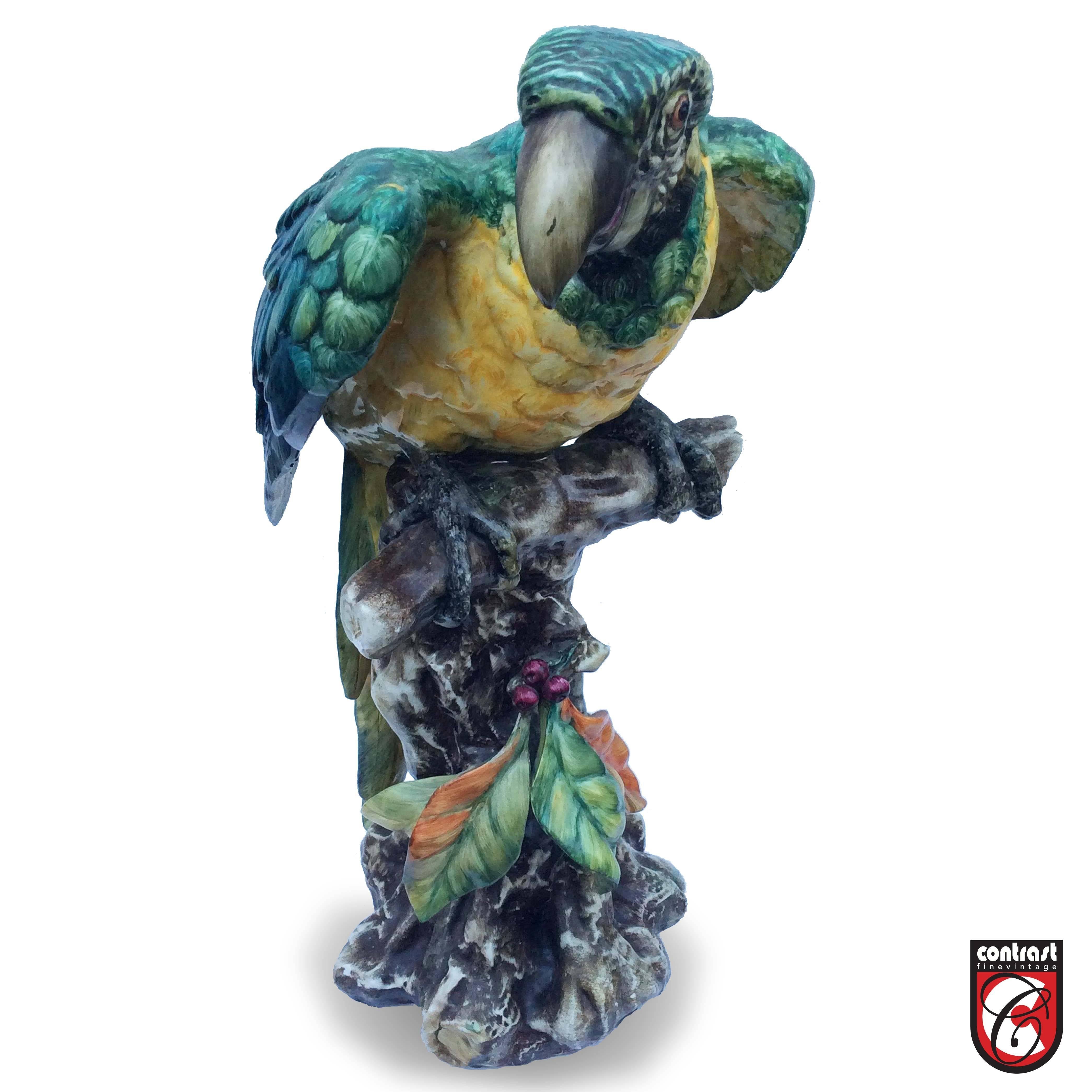An Italian porcelain parrot statue signed Guido Cacciapuoti, 1892-1953 (Italian School) Cacciapuoti along with his brothers, father and grandfather had a long family history of making ceramic sculptures in gres. He is considered the best Italian