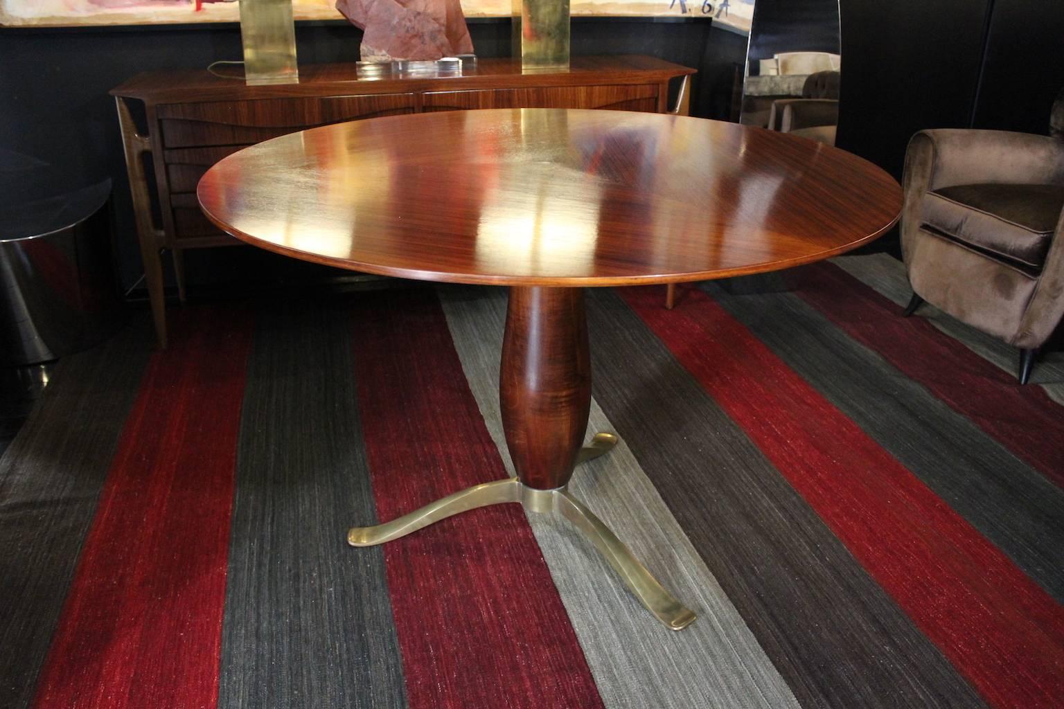 1940 round dining table made of rosewood, walnut and brass.