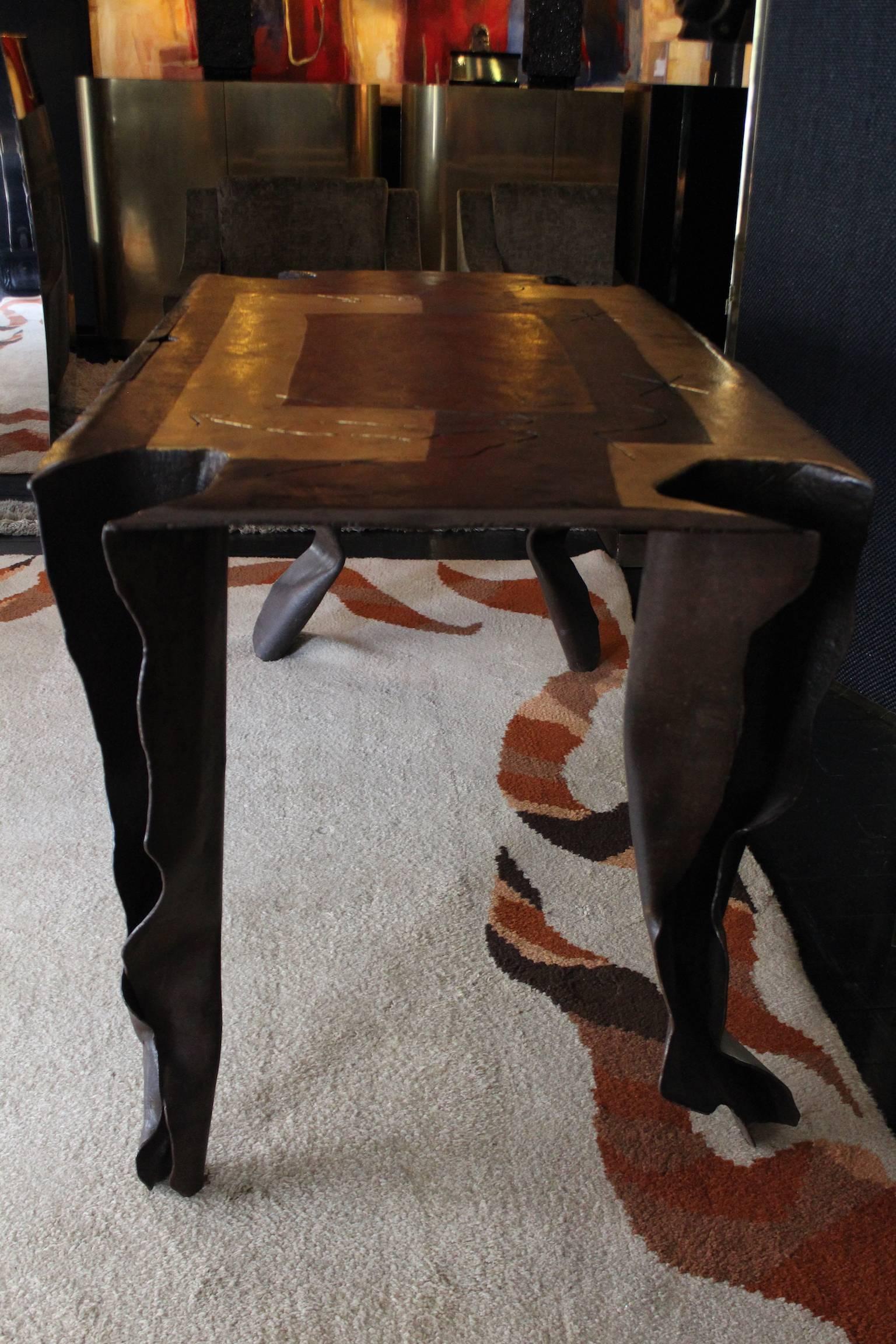 Beautiful 2001 rectangular in handcrafted iron desk in gold and bronze leaf by the French artist 