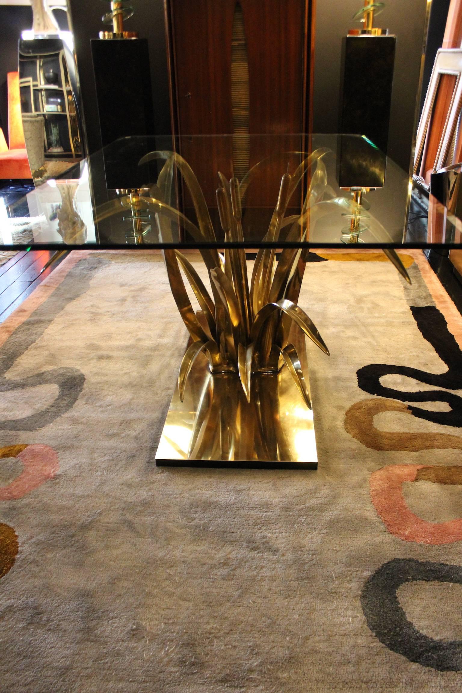 Spectacular 1970 rectangular brass dining table Maison Jansen cut glass top. The brass base reproduces a lake plant 