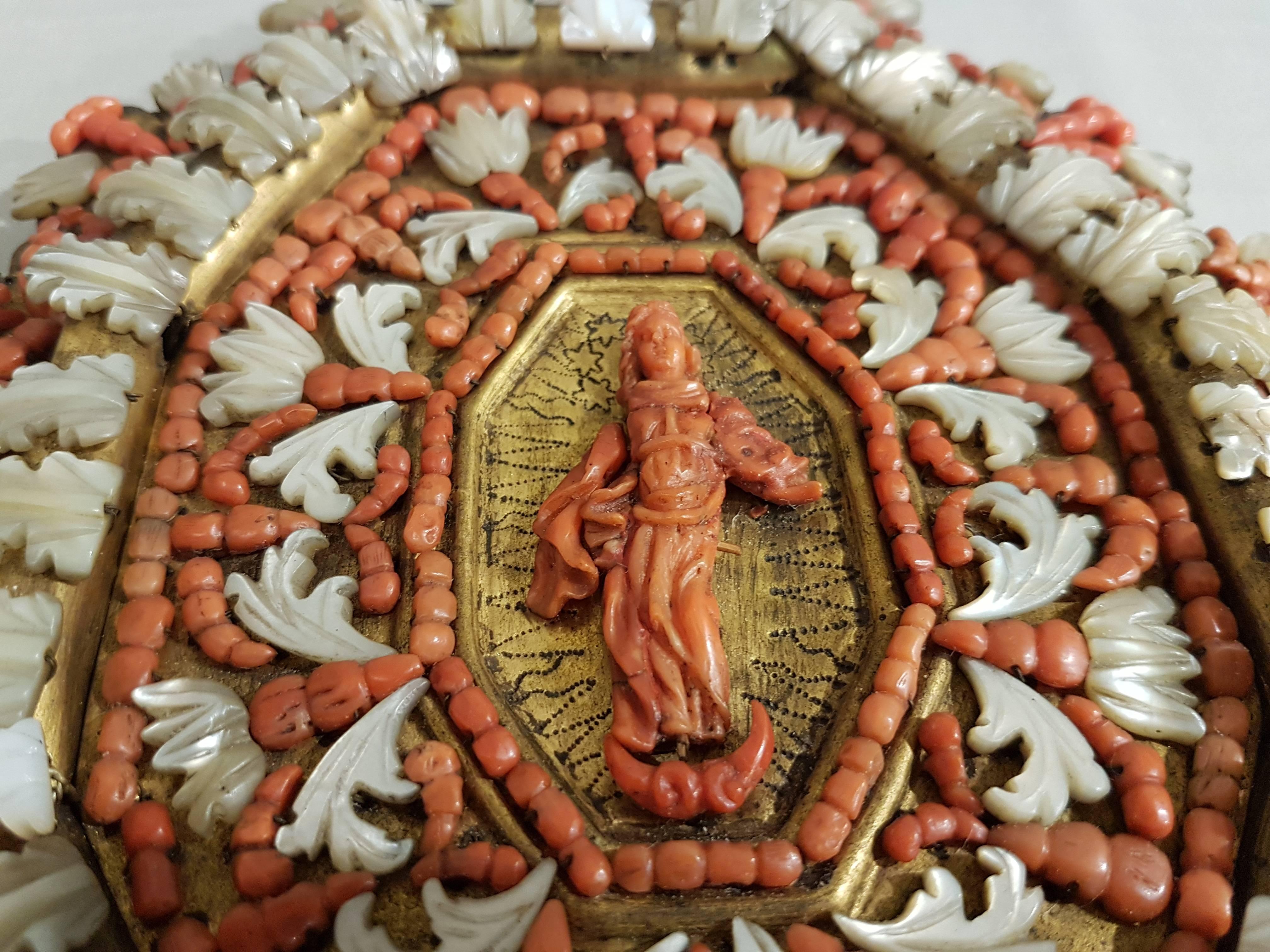 Unique and elaborate devotional plaque, representing a coral saint and decorative elements in mother-of-pearl.

Trapani, early 18th century.