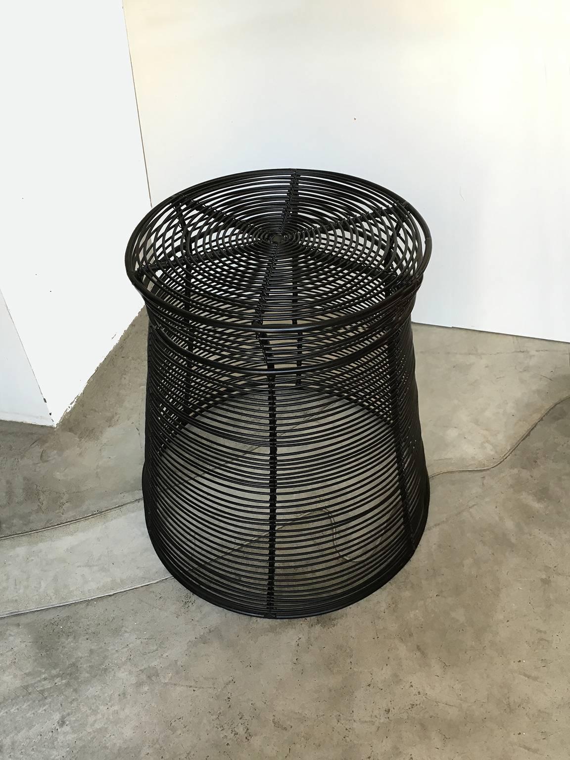 A design with conscience project. Steel wire is deliciously airy, visually pliant and weather resilient in brilliant modular furniture by celebrated designer Stephen Burks. Handwoven in South Africa by artisans working closely with the designer,