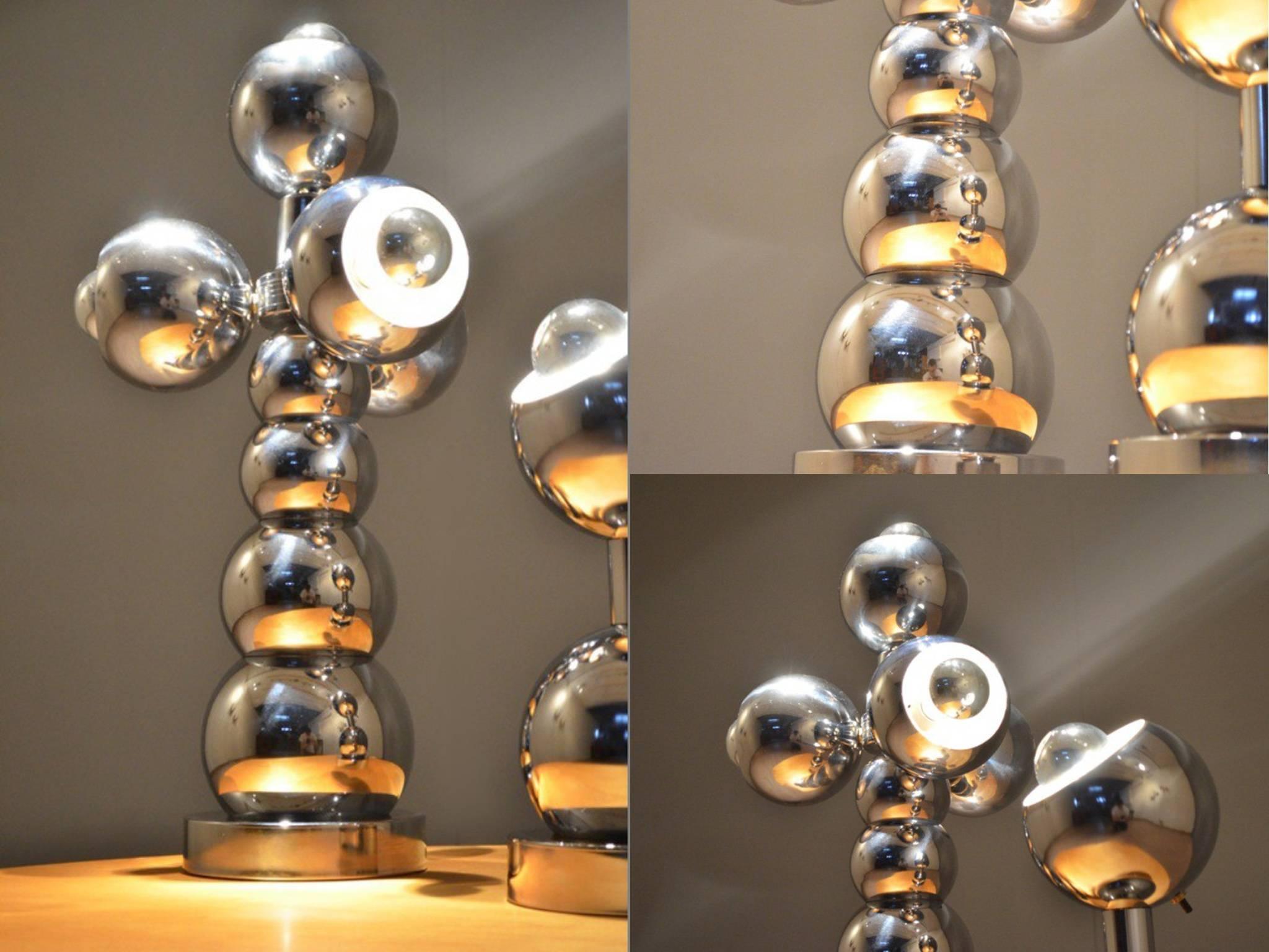 A group of two most attractive chrome lamps, of graduated sphere design, on a circular base, one with lights, the second with one, both shedding a very pleasant light when fitted with chromed dome light-bulbs,
American, circa 1960-1970.
The large