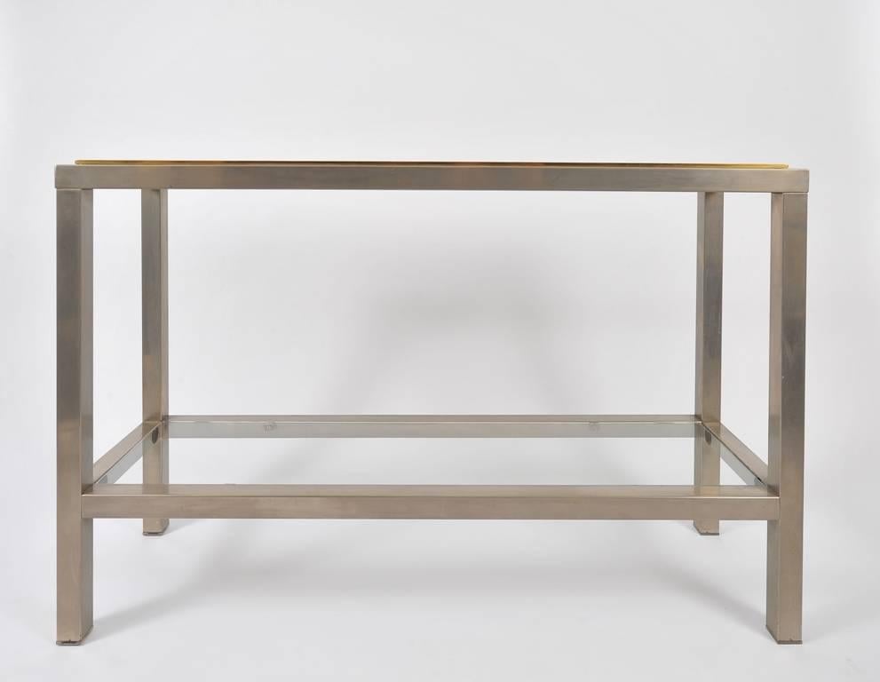 A brass and brushed steel glass top console table
France, circa 1970.