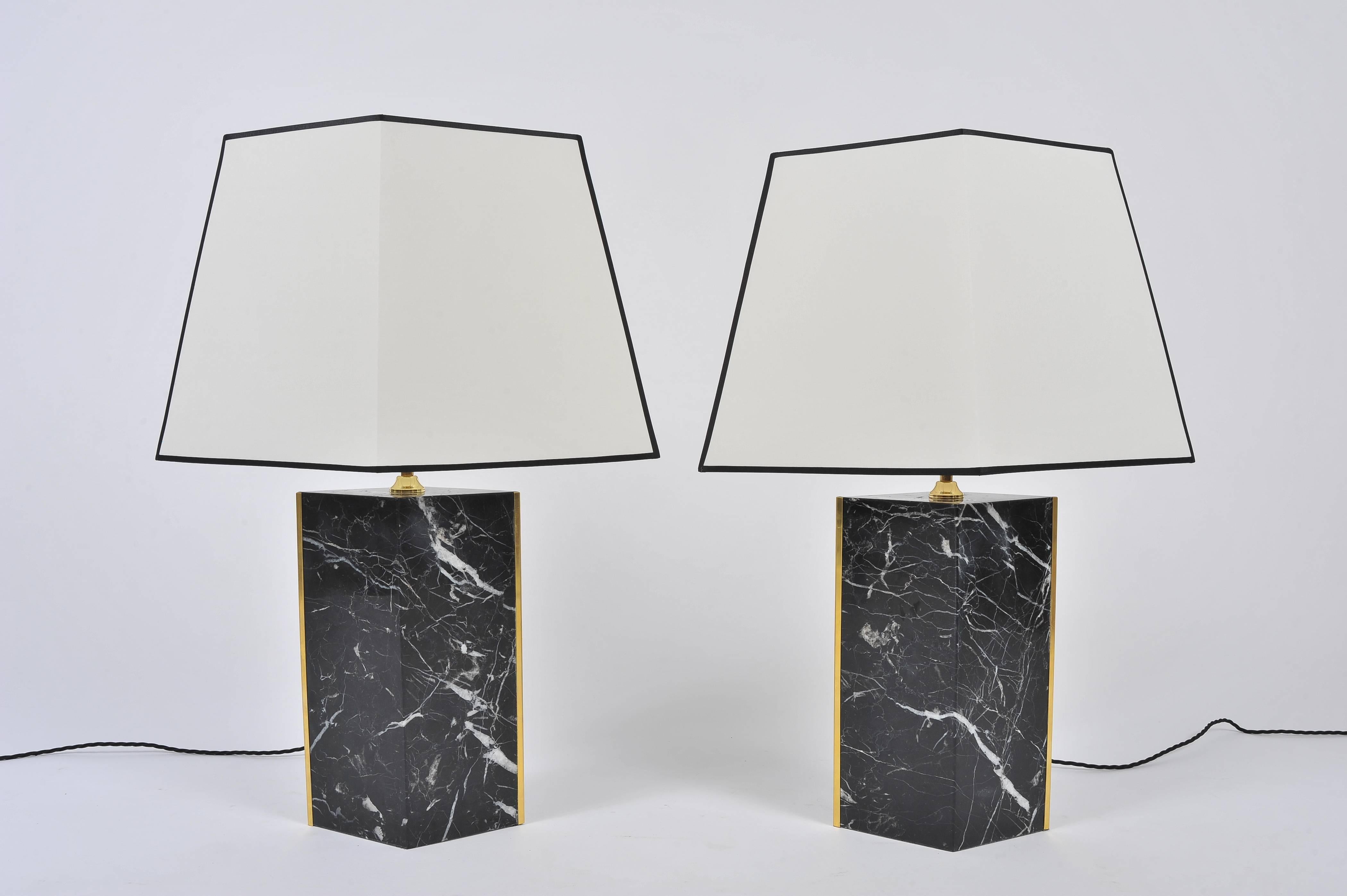 A pair of solid brass and black marble lozange shape lamps, with bespoke lozange tapered black edged ivory fabric shades.
Designed by Dorian
Limited edition of 20 - This pair consists of 3/20 and 4/20
Marble sourced from Italy, brass made in the
