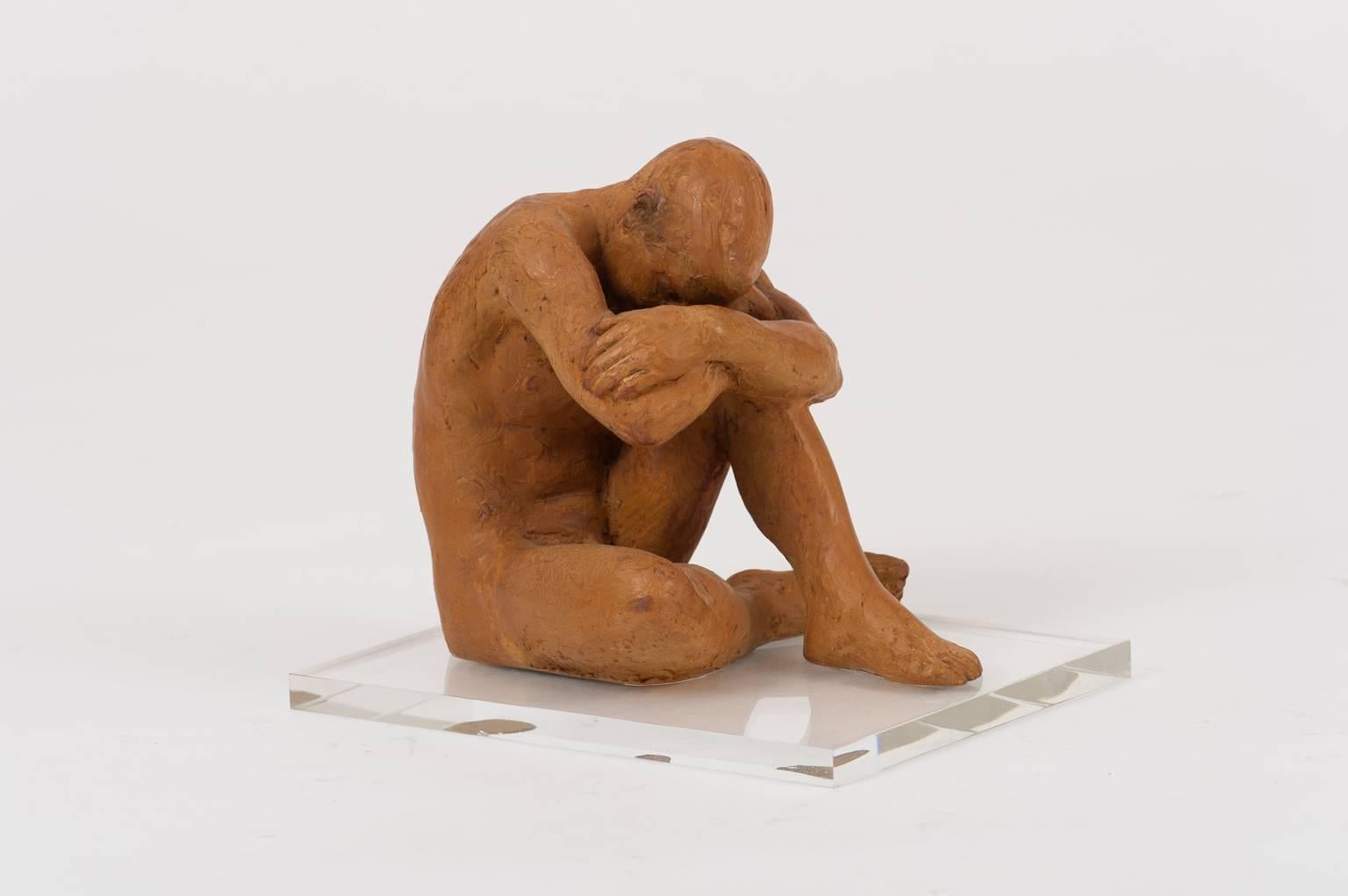A terracotta sculpture depicting a reclining nude man, superbly stylised and executed.
Mounted on a modern Perspex base, 
France, circa 1940
Measures: 26 cm high by 22 cm high by 19 cm deep.