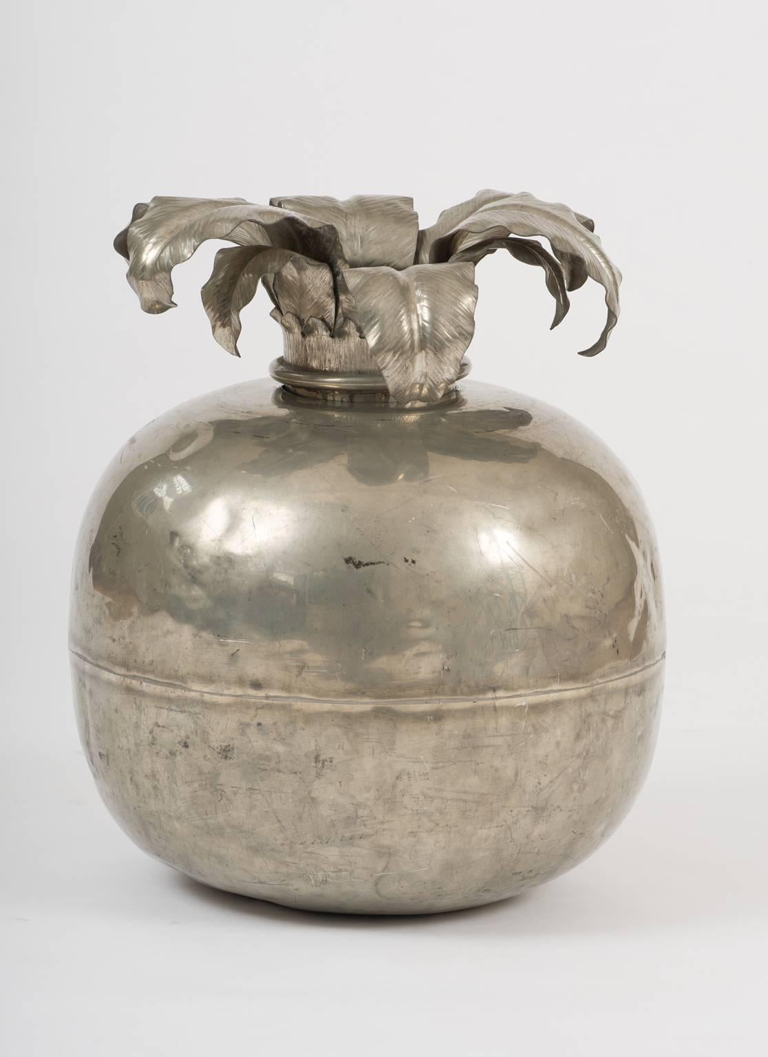 A most unusual and monumental silvered pomegranate vase, enclosing a useful compartment for storing water and flower stems, 
Italy, circa 1950.