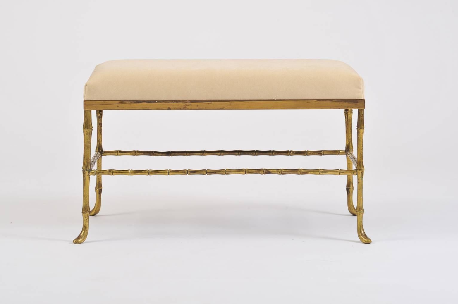 A brass stylized bamboo rectangular stool, possibly by Maison Bagues
Upholstered in ivory velvet
France, circa 1950.