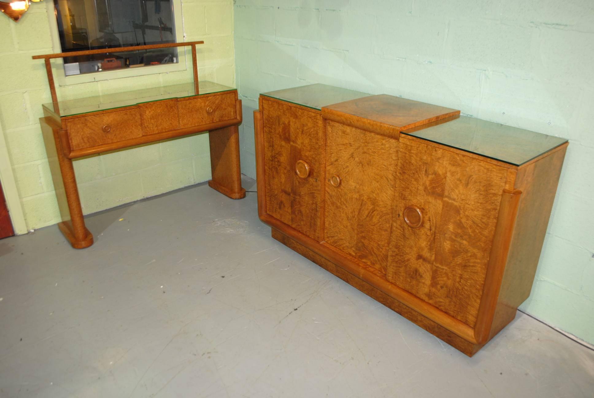 A truly stunning original Art Deco Hille dining room suite comprising of table, eight chairs (Two Carvers), sideboard with integral cocktail cabinet and a server.

I have to say to date this has to be the most fantastic and original full set of